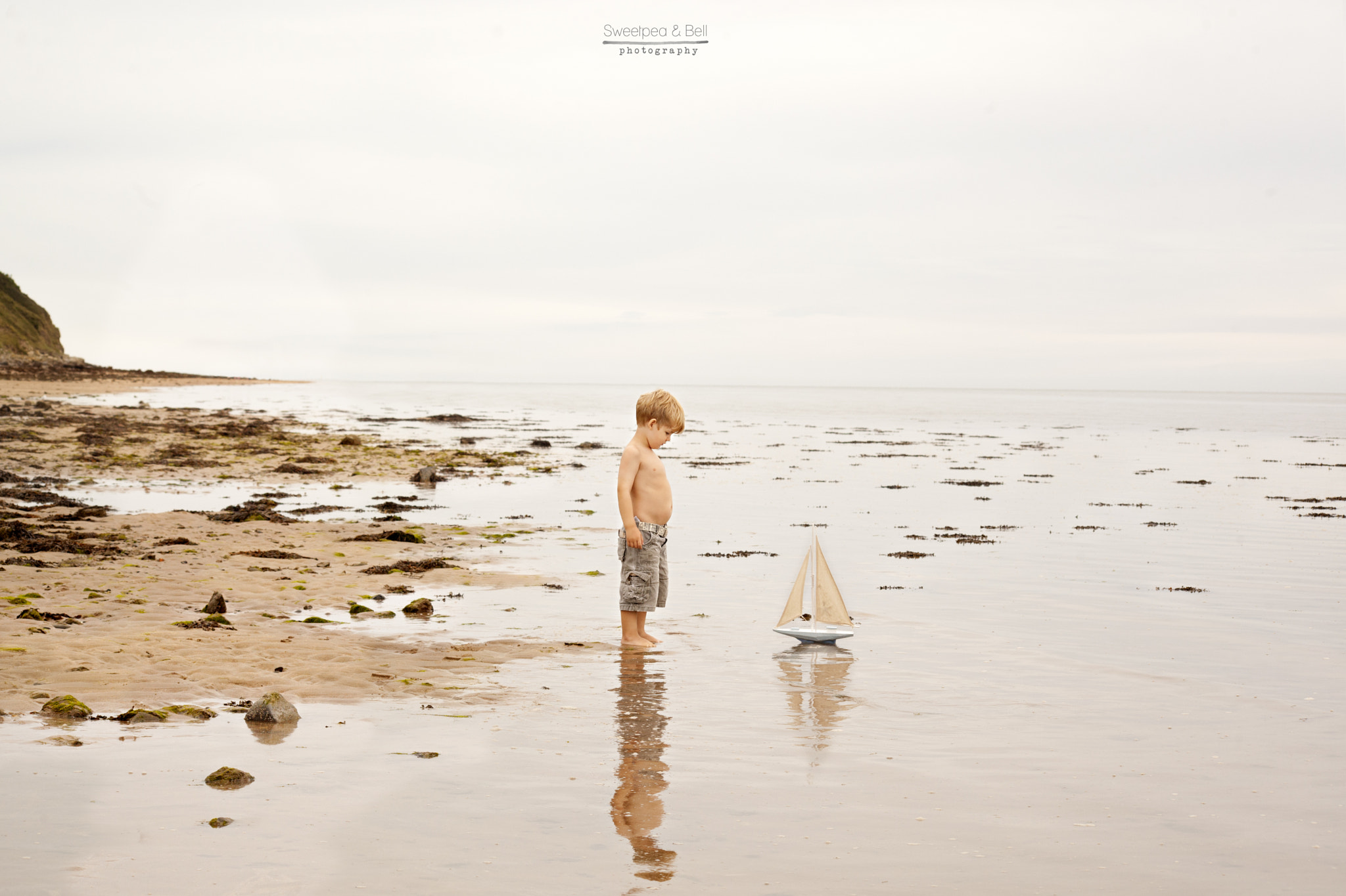 Sigma 70-300mm F4-5.6 APO DG Macro sample photo. Just a boy his belly and a boat photography