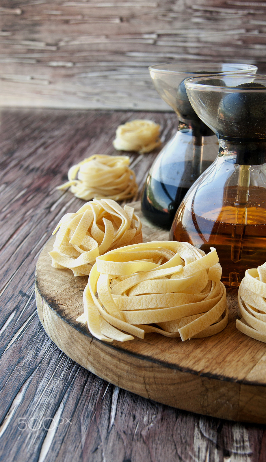 Sony Alpha DSLR-A380 sample photo. Uncooked pasta with flour on the table, selective focus photography