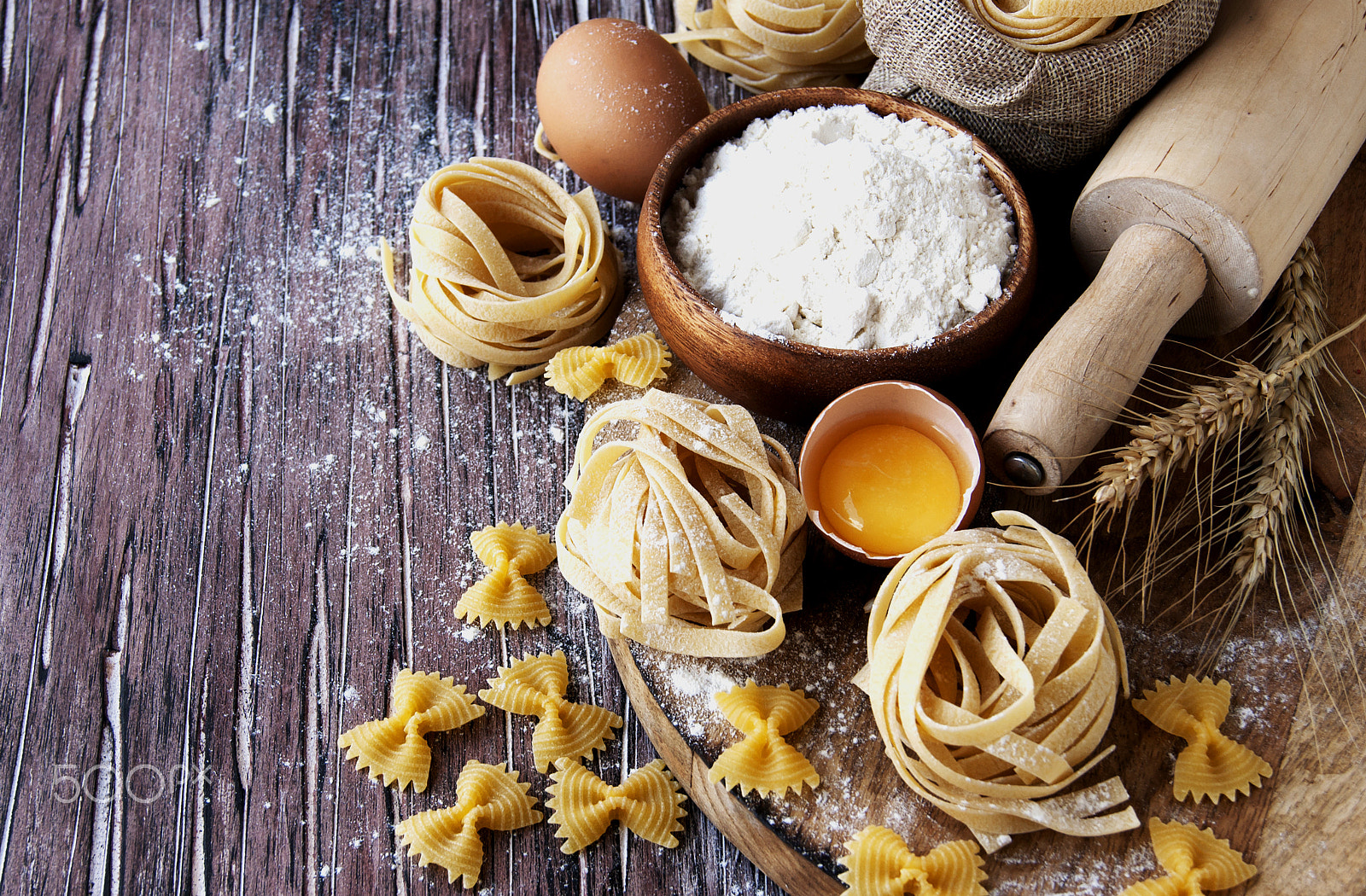 Sony Alpha DSLR-A380 sample photo. Uncooked pasta with flour on the table, selective focus photography