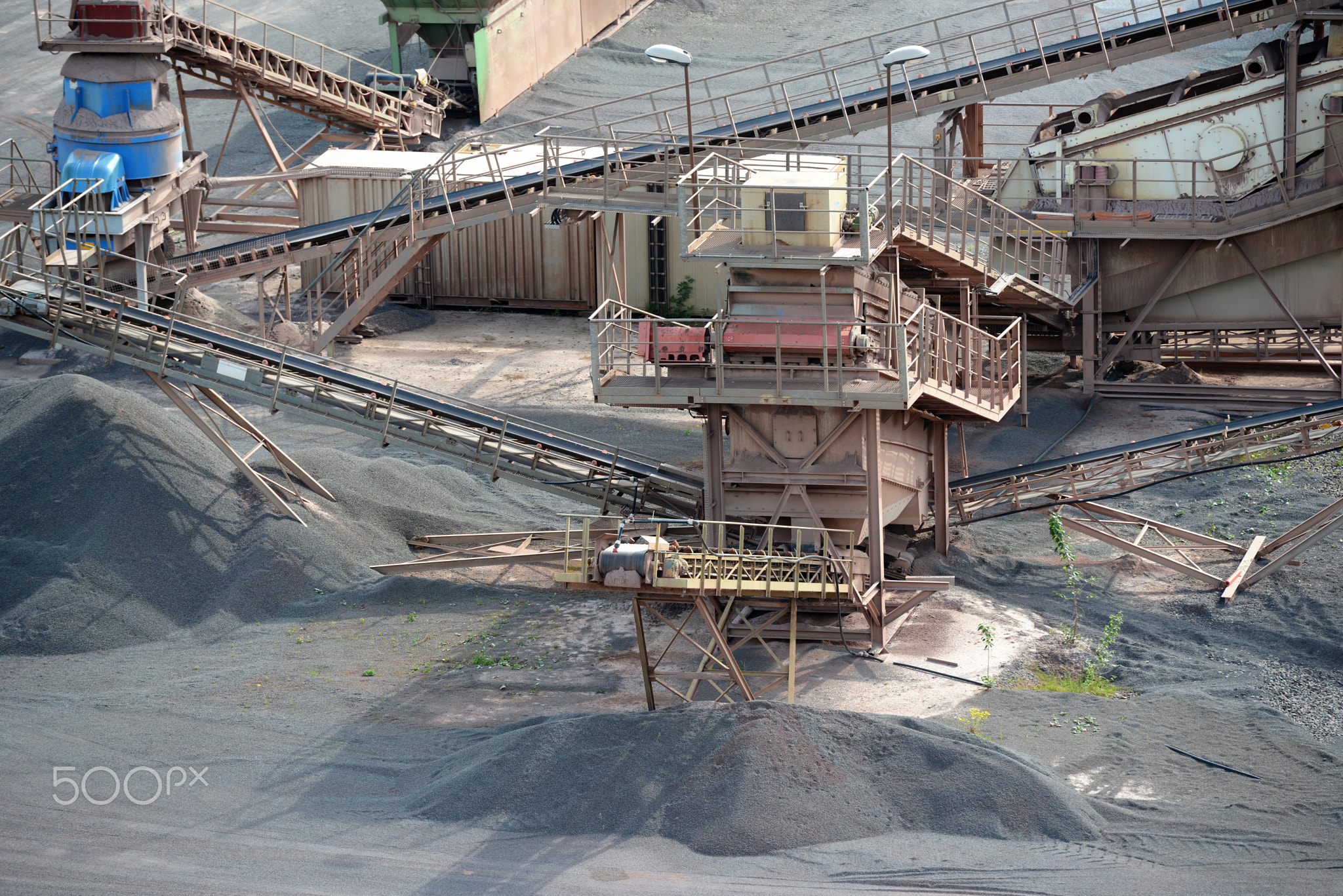 stone crusher machine in an open pit mine. mining industry