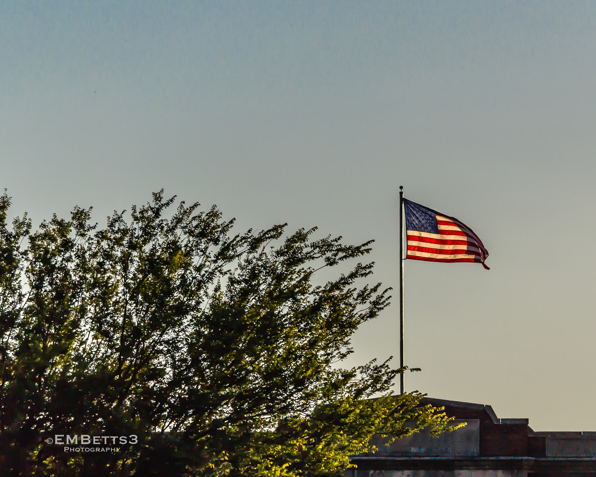 Canon EOS 100D (EOS Rebel SL1 / EOS Kiss X7) + Canon EF-S 55-250mm F4-5.6 IS STM sample photo. American flag over petersburg, virginia. photography