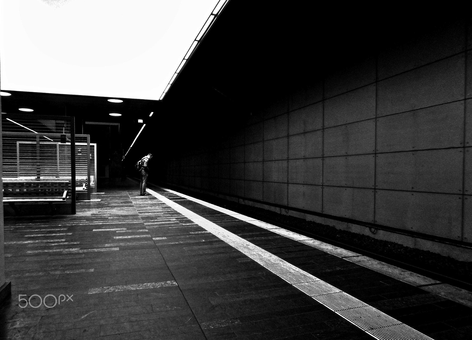 Panasonic DMC-SZ10 sample photo. Lonely man in the train station photography