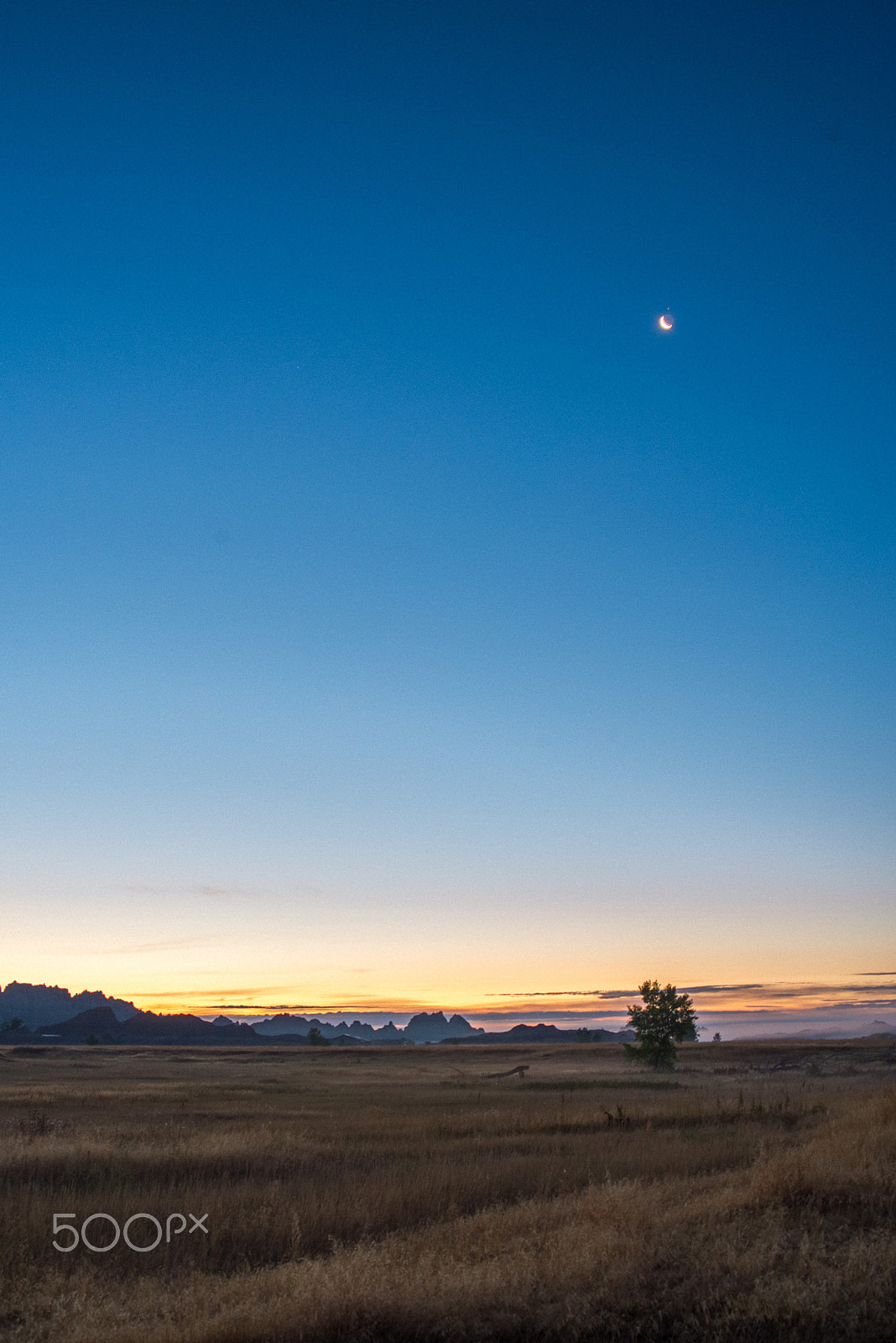 Nikon D610 + AF Zoom-Nikkor 28-80mm f/3.3-5.6G sample photo. Sunrise and moon set, badlands national park photography