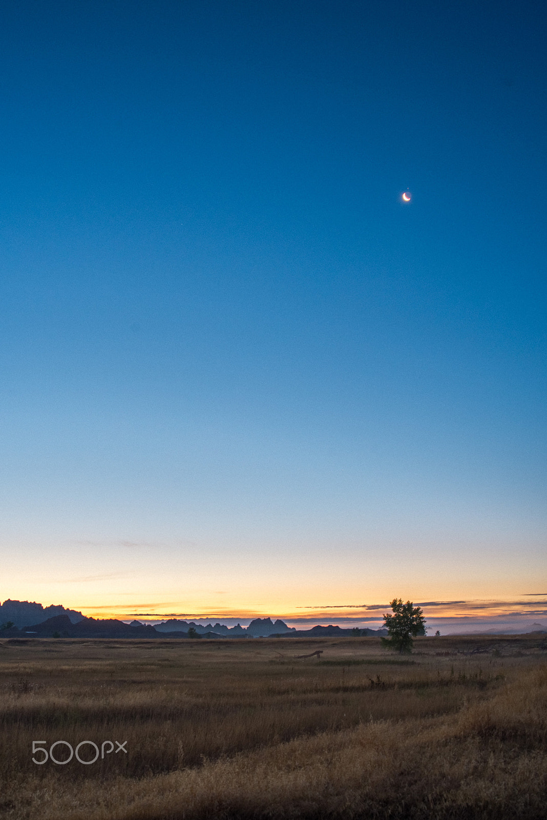 AF Zoom-Nikkor 28-80mm f/3.3-5.6G sample photo. Sunrise and moon set, badlands national park photography