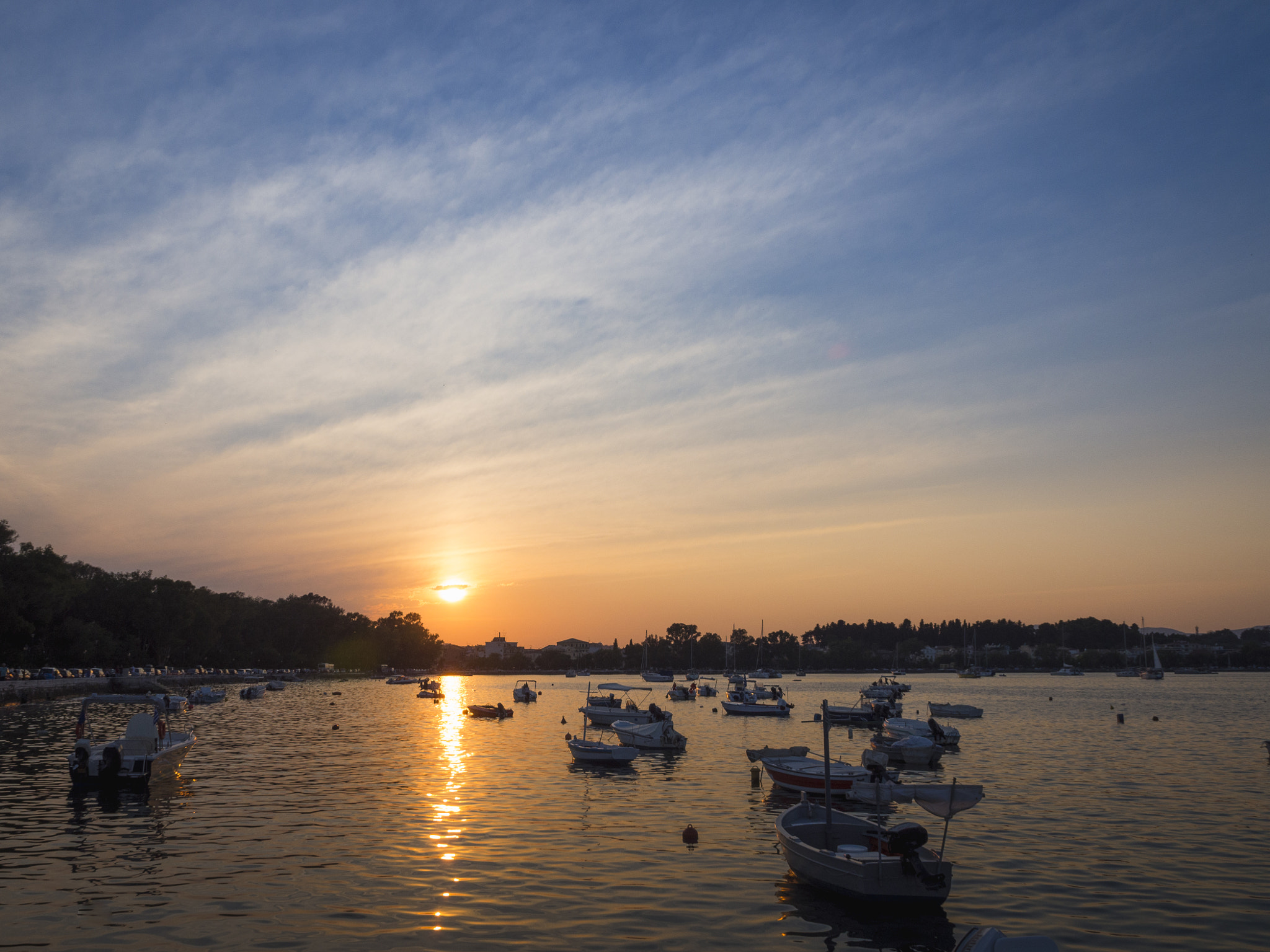 OLYMPUS M.14-150mm F4.0-5.6 II sample photo. Bay sunset with boats photography