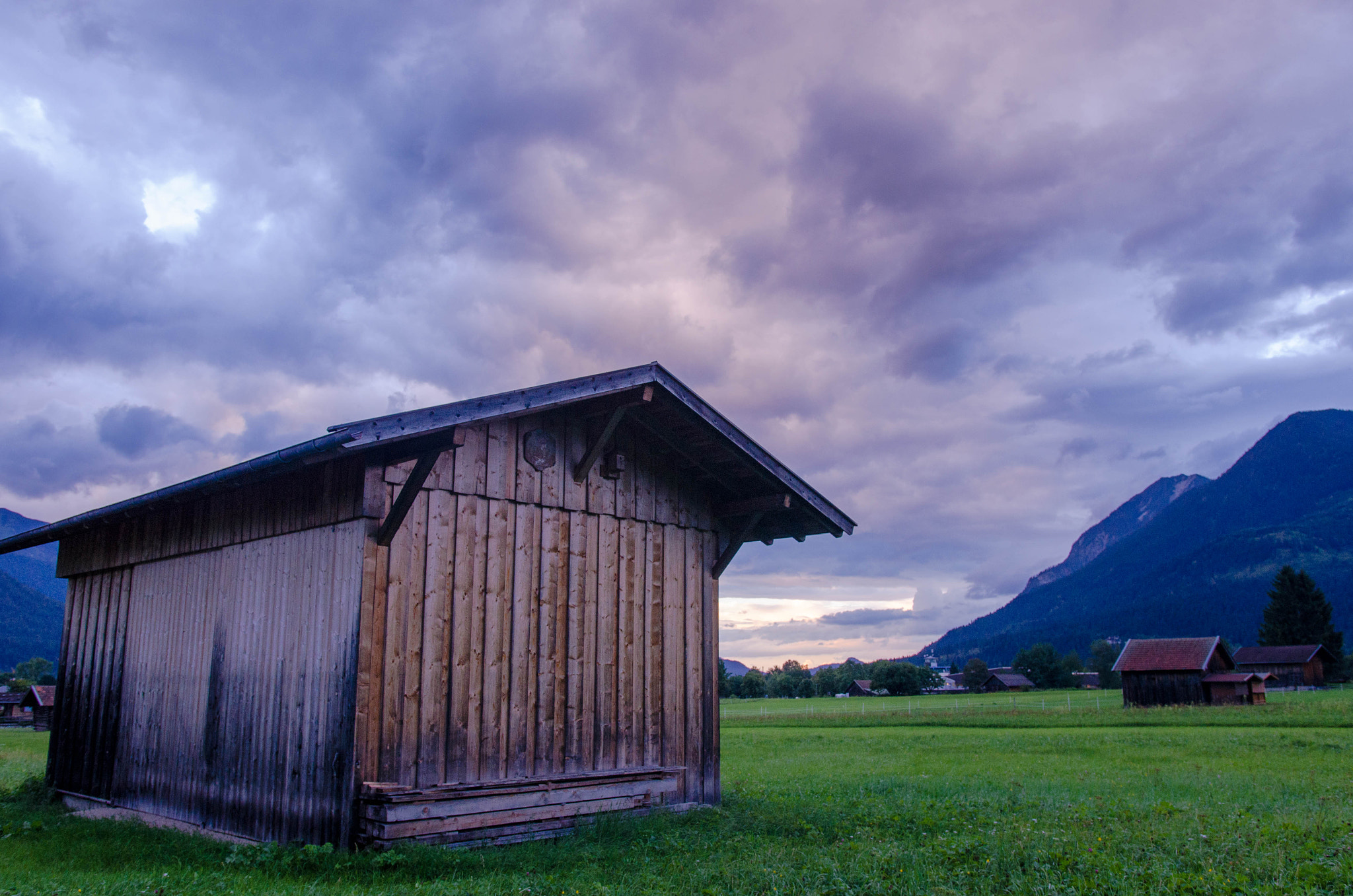 Nikon D5100 + Sigma 18-35mm F1.8 DC HSM Art sample photo. Evening at alpine farmland photography