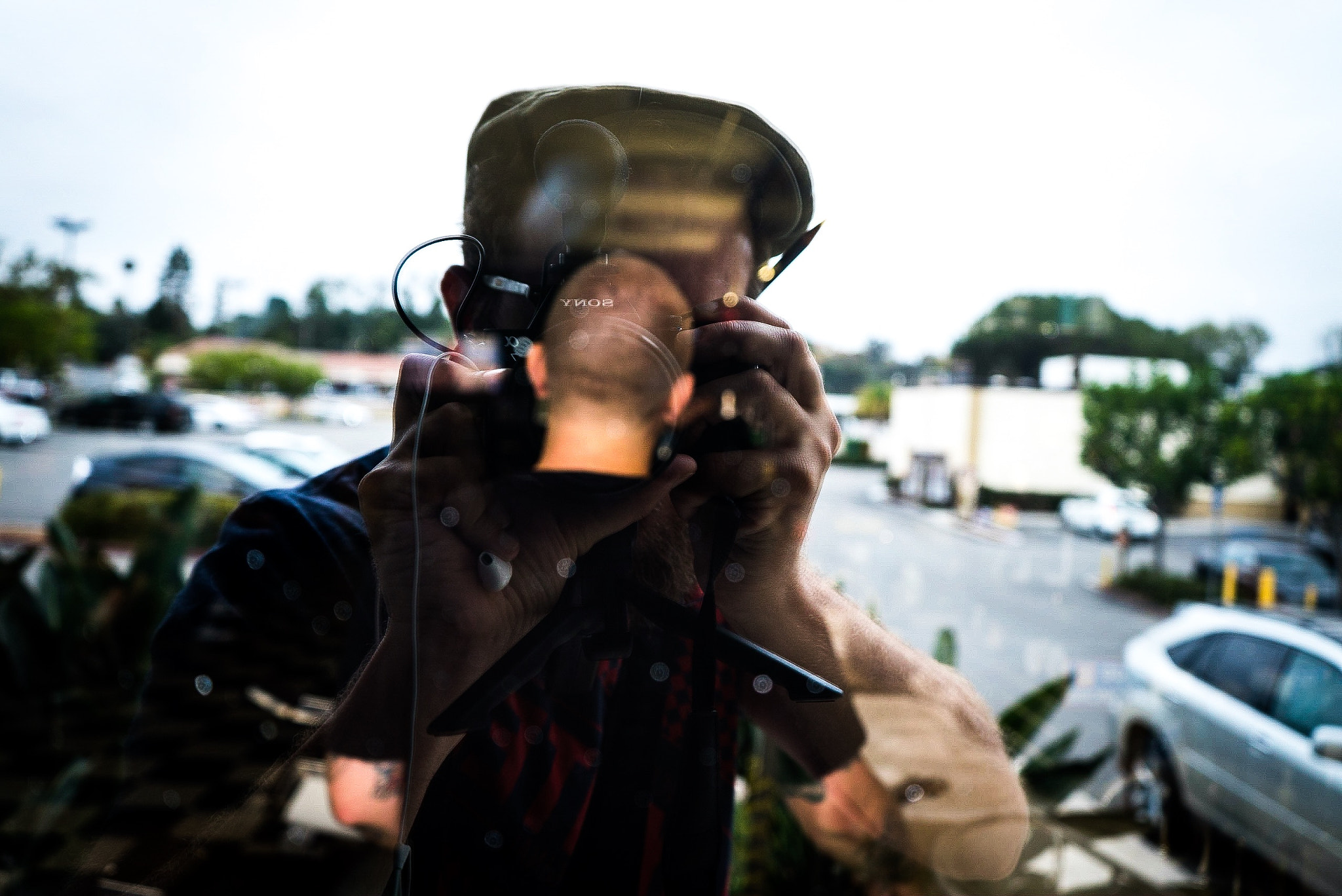 Sony a7S + Sony FE 28-70mm F3.5-5.6 OSS sample photo. Selfie through the windows of a barber shop photography