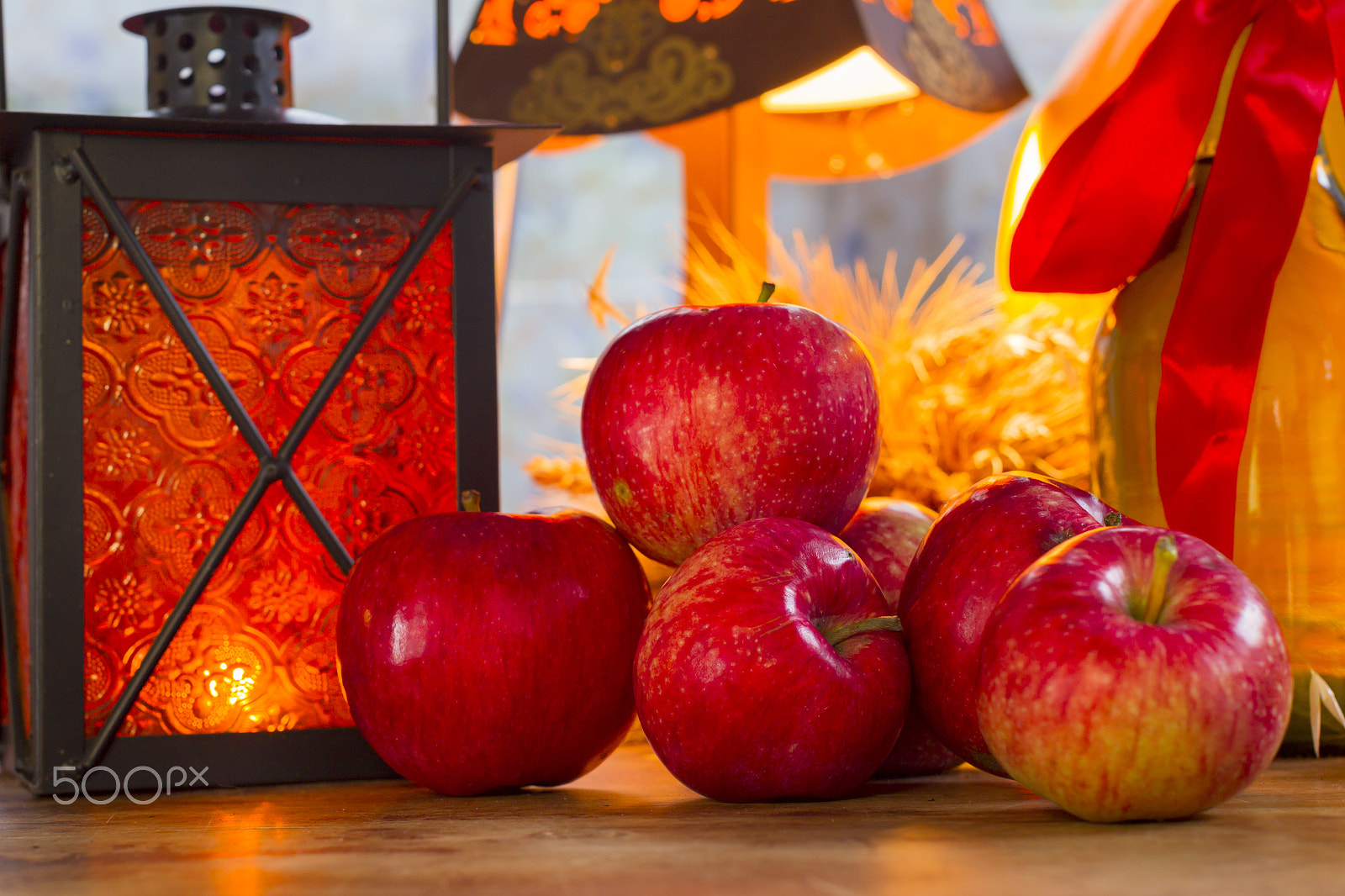 Canon EOS-1D Mark IV sample photo. Red apples, orange lantern, a bottle of sunflower oil, ears of w photography