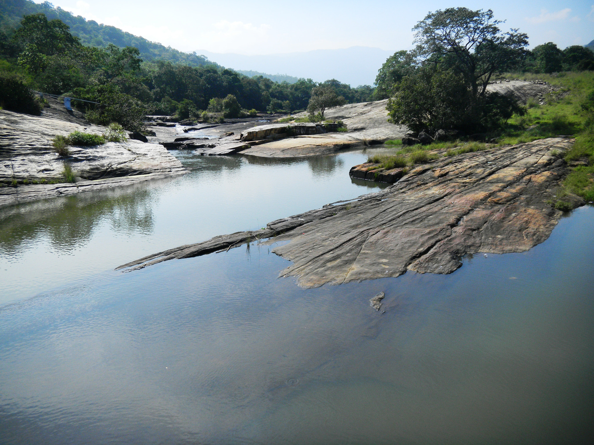 Nikon Coolpix S1100pj sample photo. Still water between rocks photography