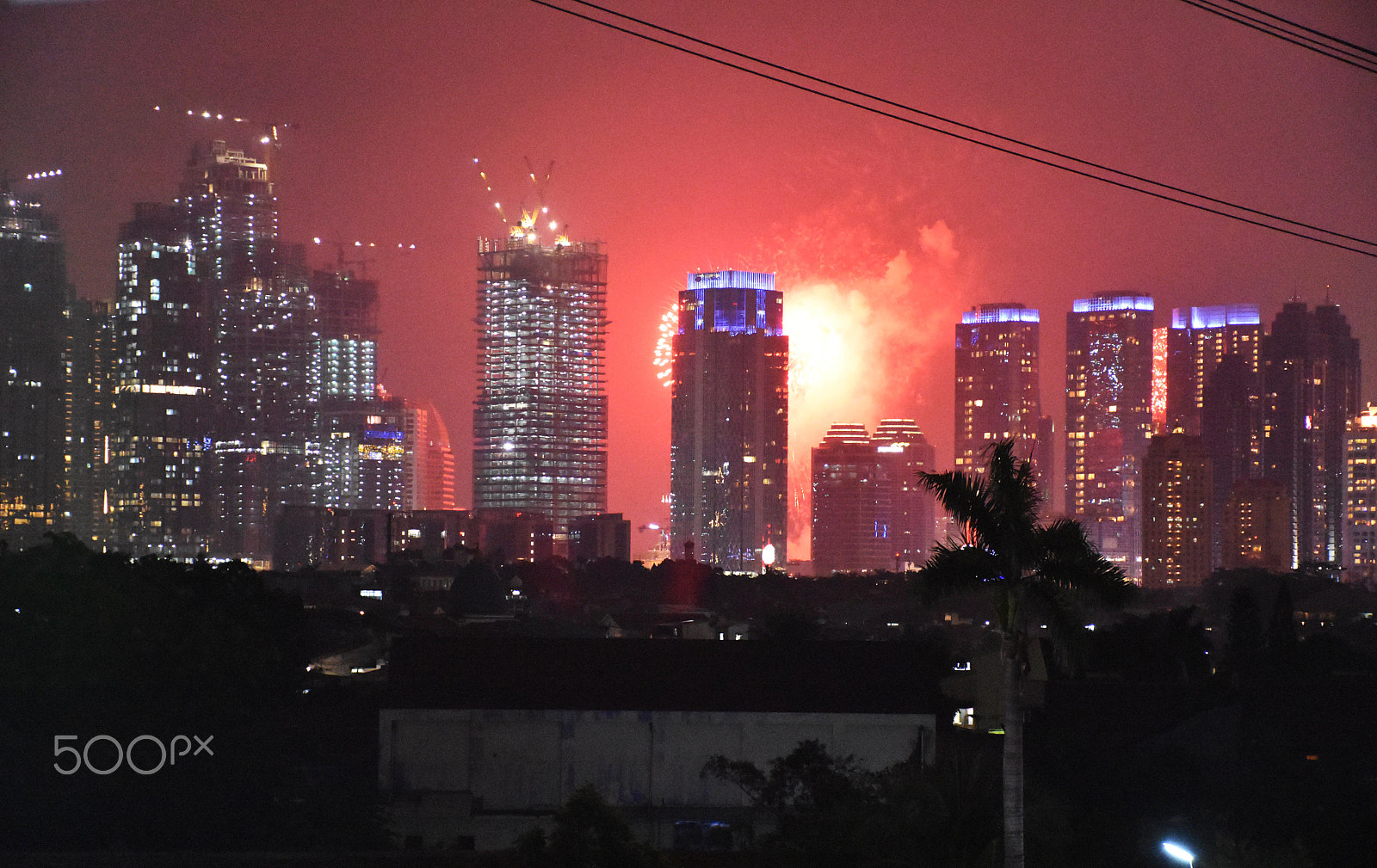 Nikon D7200 + Nikon AF Micro-Nikkor 200mm F4D ED-IF sample photo. Fireworks behind the building photography