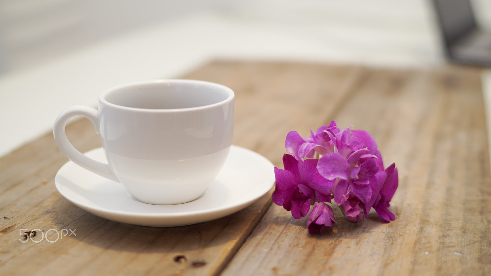 Sony Distagon T* FE 35mm F1.4 ZA sample photo. Cup of coffee on a wooden table photography