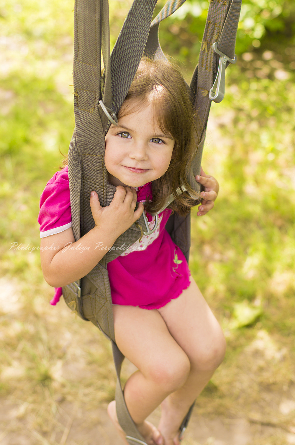 Sony SLT-A37 + Sony 50mm F1.4 sample photo. Little girl swinging on a parachute straps photography