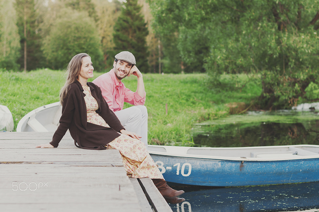 Nikon D300S + Nikon AF-S Nikkor 50mm F1.4G sample photo. Happy young couple walking in the park photography