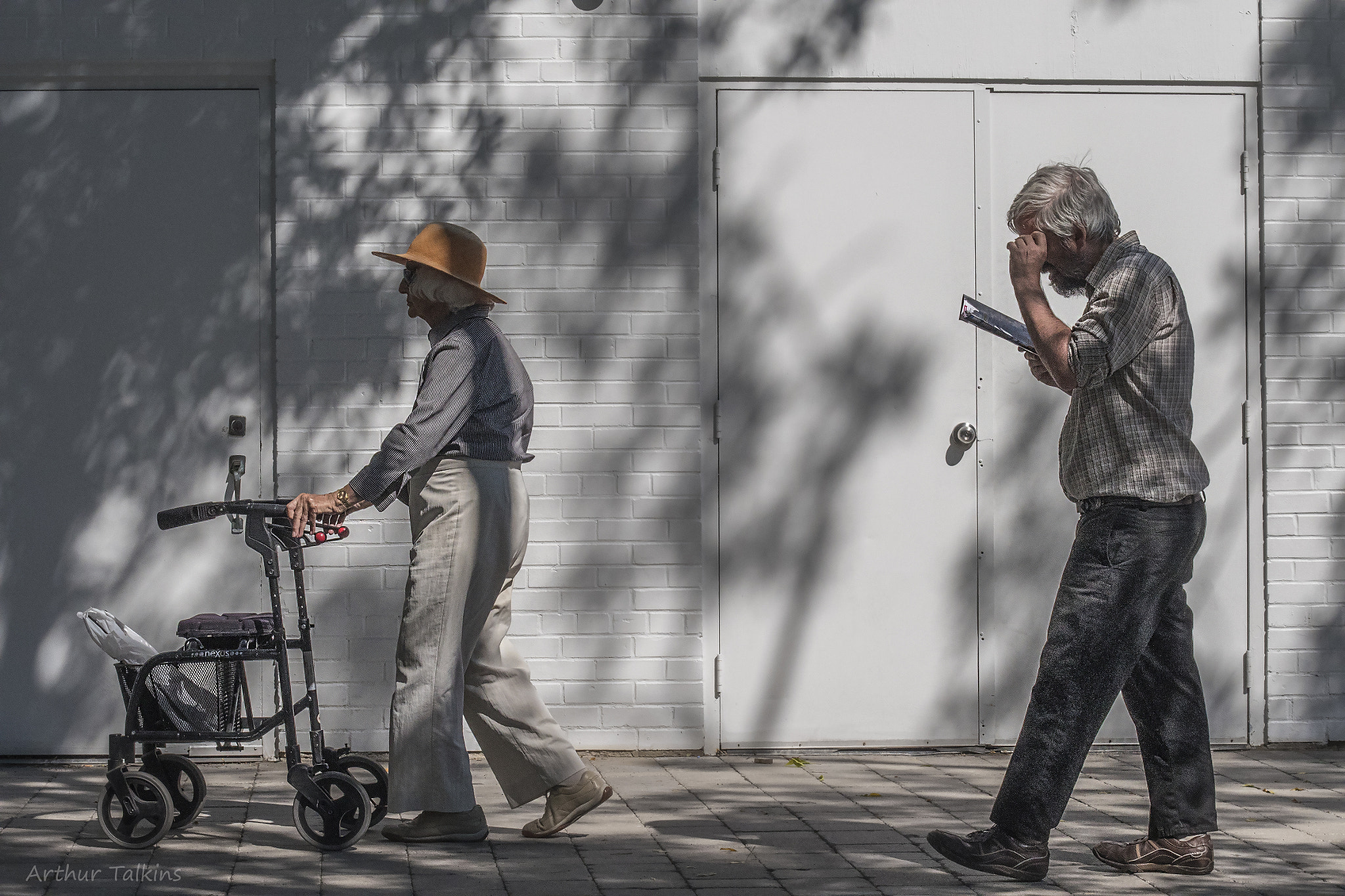 Sigma 70-200mm F2.8 EX DG Macro HSM II sample photo. She walks, he reads...summer in the city...! photography