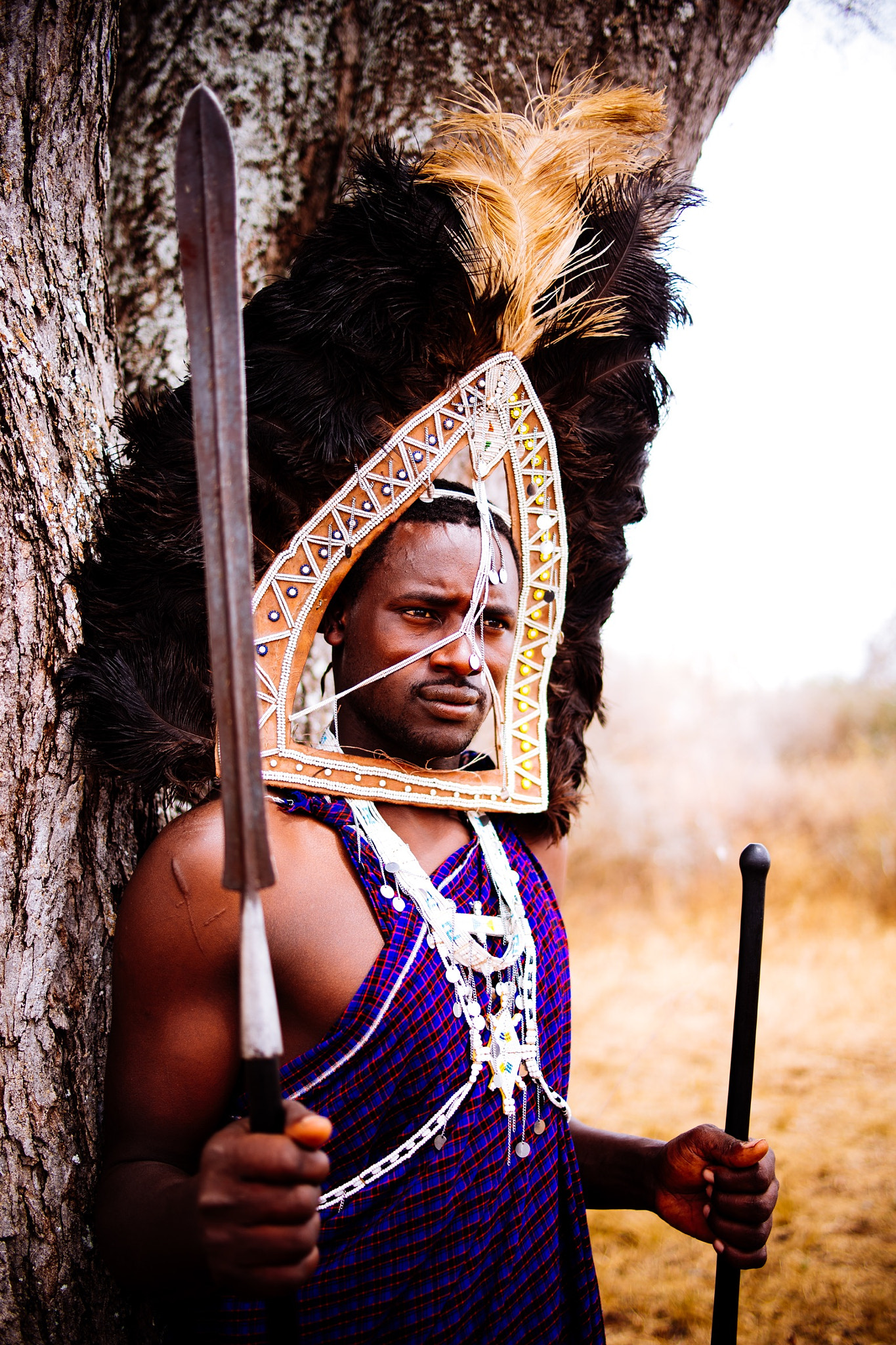 Zeiss Milvus 35mm f/2 sample photo. Portrait of a moran wearing an ostrich feather hea ... photography