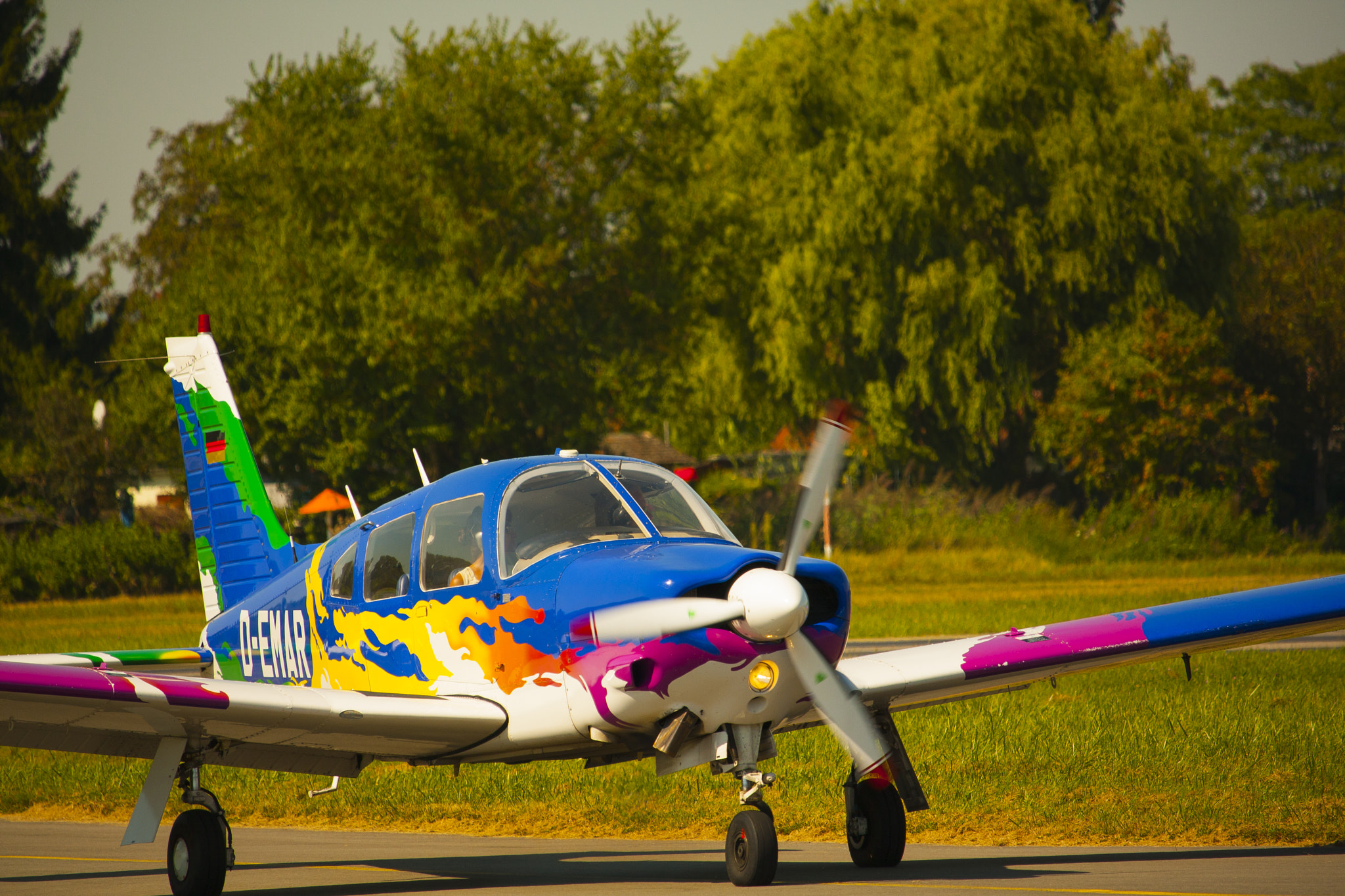 Canon EF-S 55-250mm F4-5.6 IS STM sample photo. Colorful plane photography