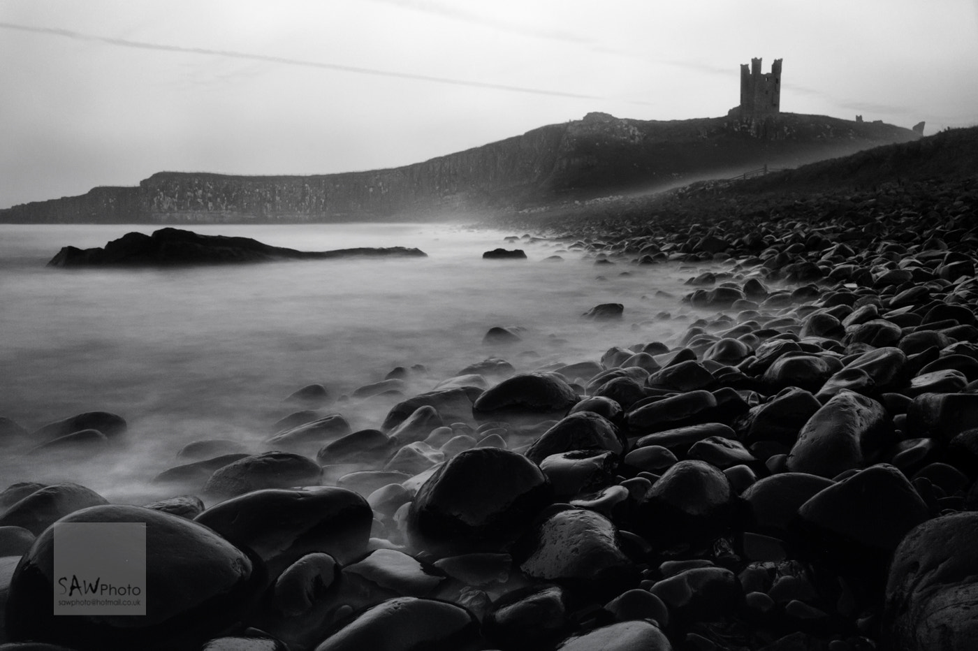 Nikon D3 sample photo. Sea fret rolling in at dunstanburgh castle photography