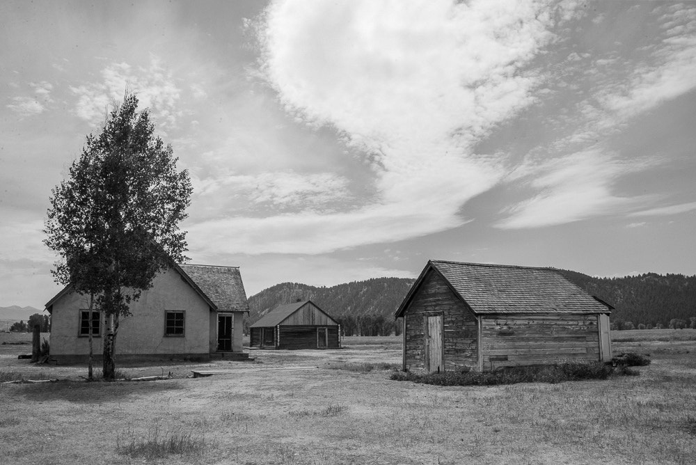 AF Zoom-Nikkor 28-80mm f/3.3-5.6G sample photo. Sky with trio of buildings, mormon row, moose wy photography