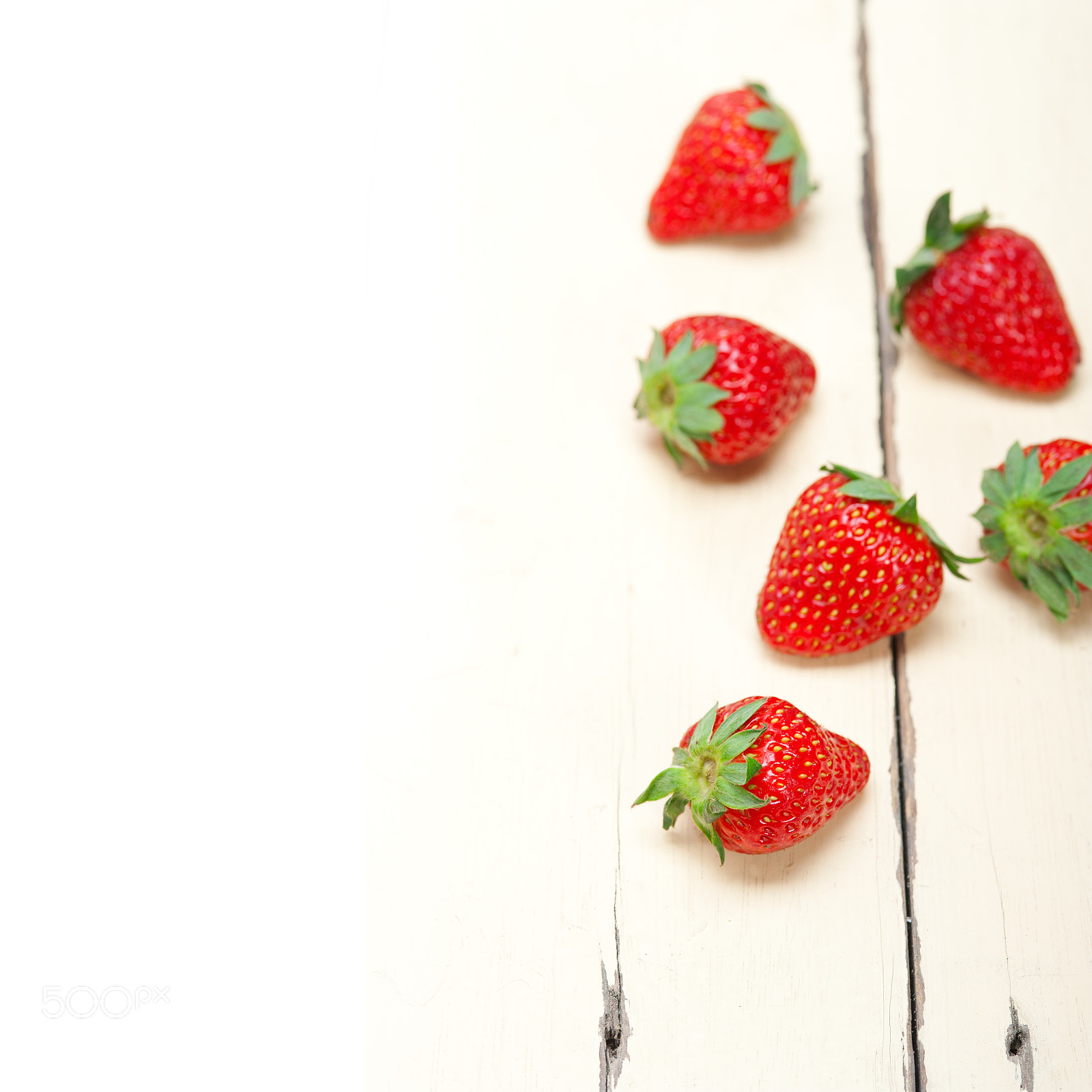 Nikon D700 + AF Micro-Nikkor 105mm f/2.8 sample photo. Fresh organic strawberry over white wood photography
