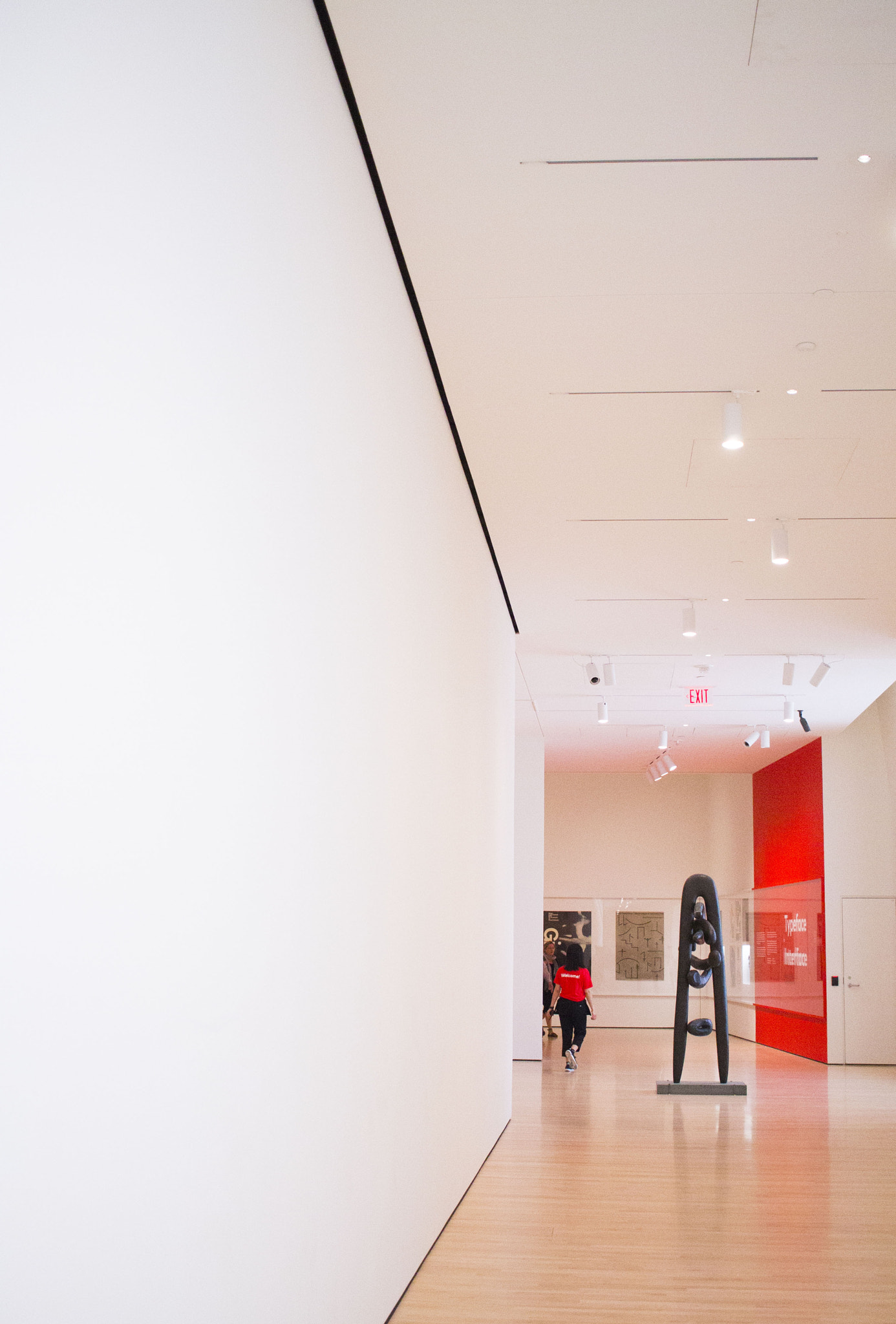 Canon EF-S 24mm F2.8 STM sample photo. Sfmoma floor with red splash wall photography