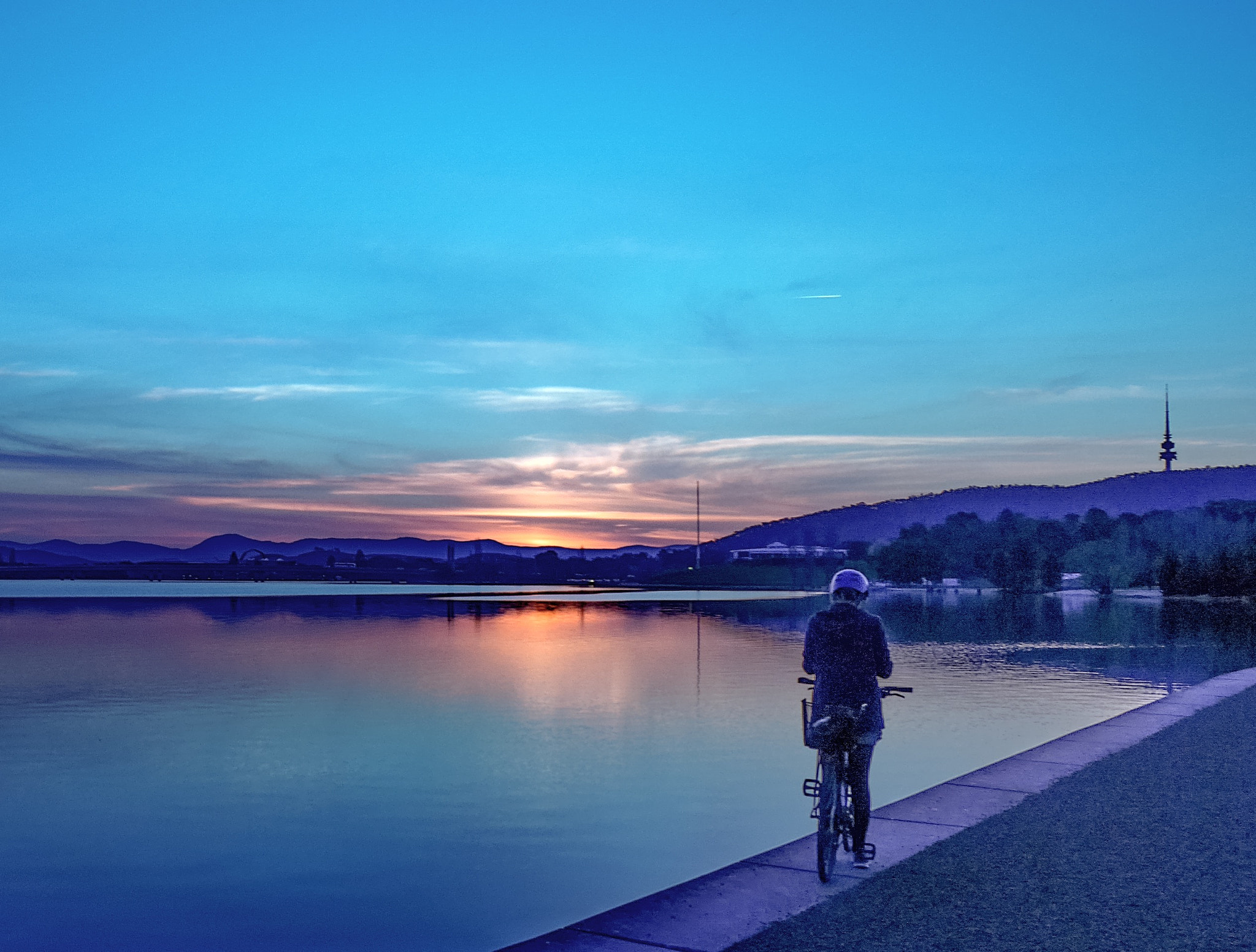 Panasonic DMC-GM1S sample photo. Woman on bike - location: lake burley-griffin, act, australia photography