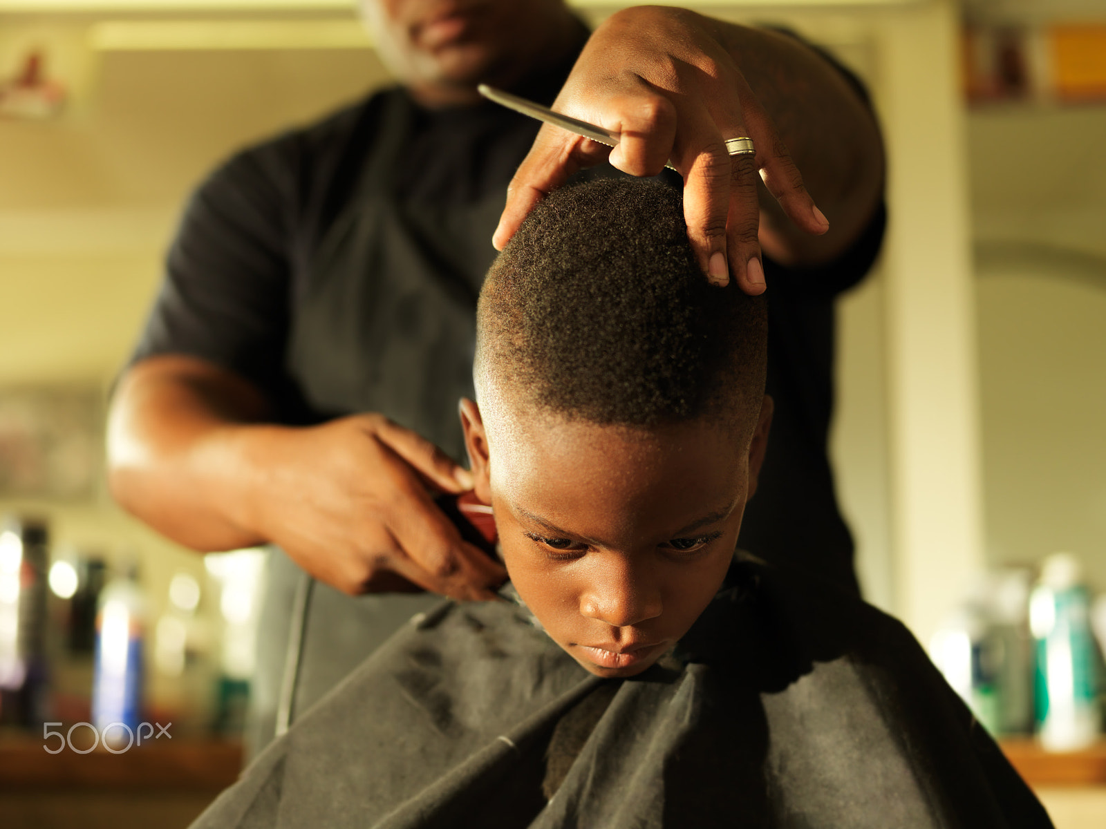 Hasselblad H3DII-39 + HC 80 sample photo. Little boy getting hair cut by barber photography