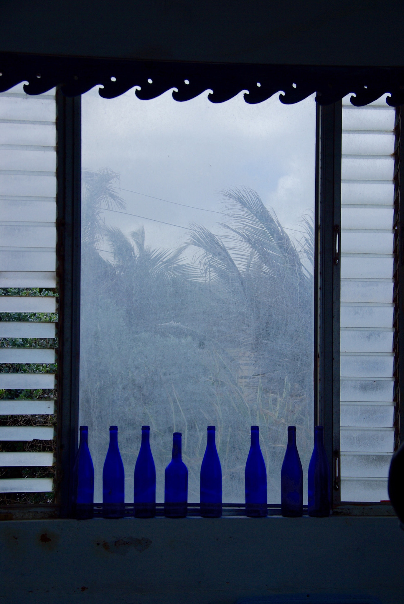 Pentax K10D sample photo. Blue bottles- dirty windows photography
