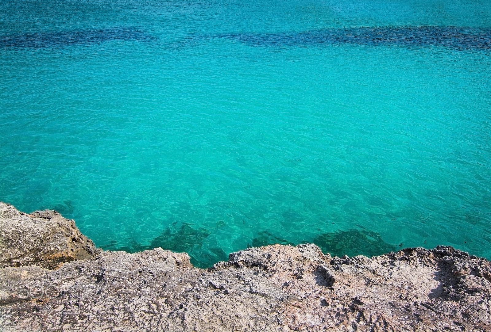 Nikon D7100 sample photo. Rock and clear turquoise water background photography
