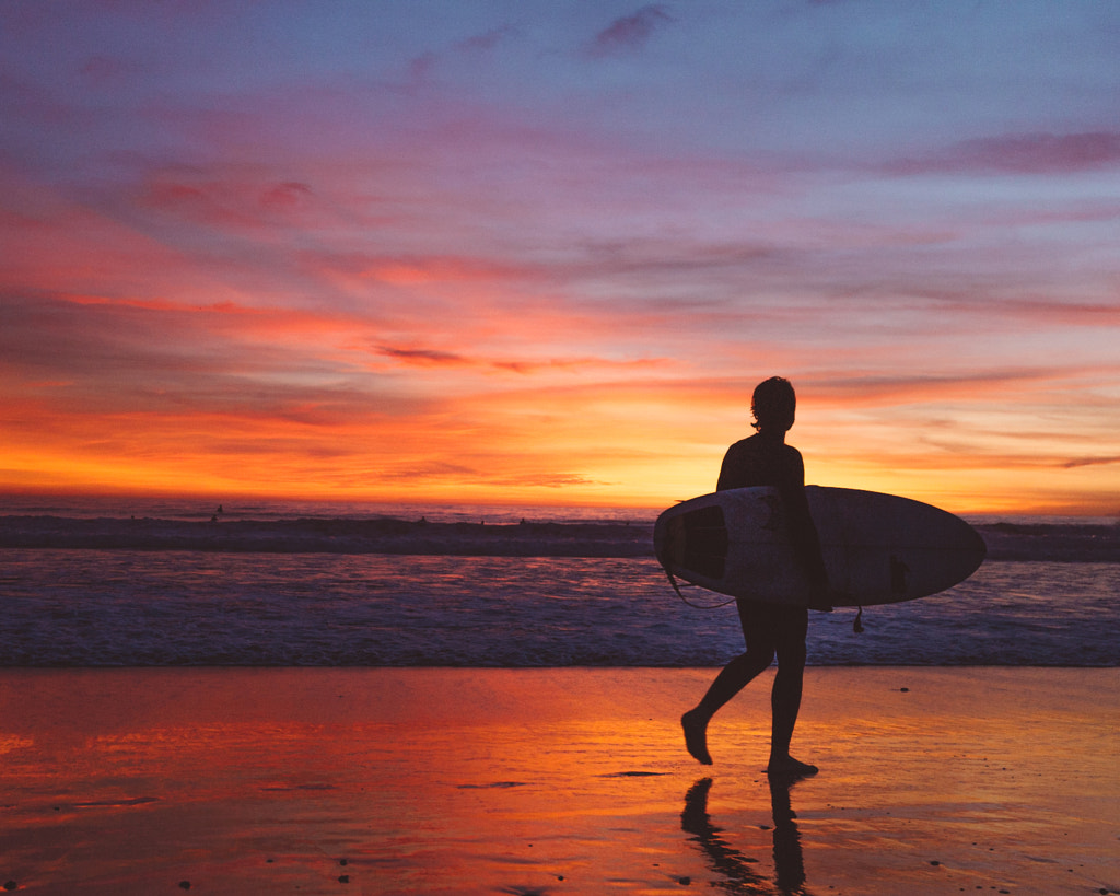 Surfer at sunset on Venice Beach by Ashley McKinney on 500px.com