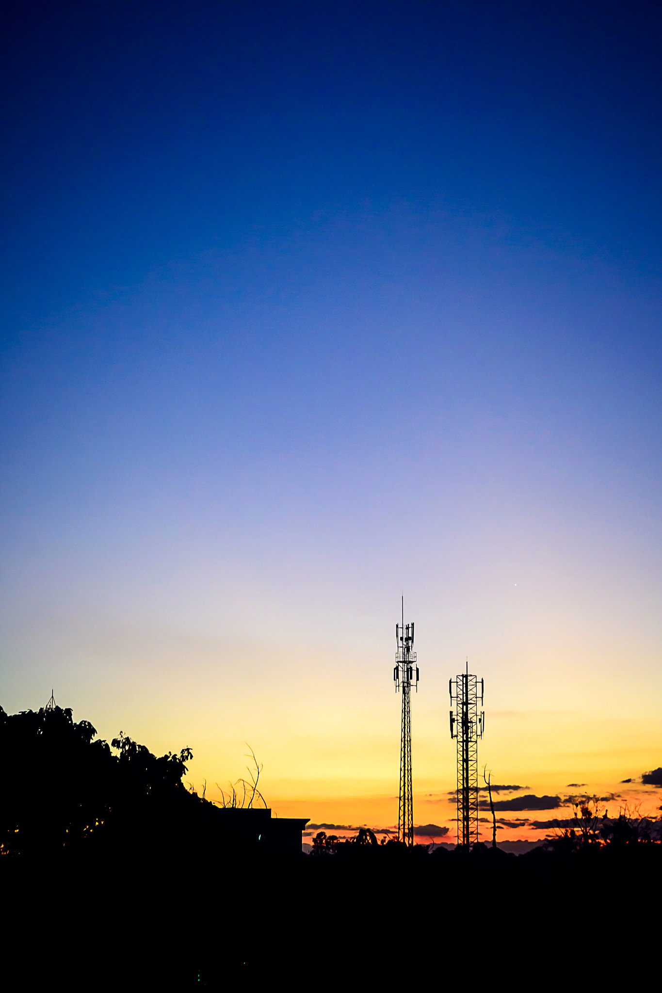sunset sky with silhouette antenna