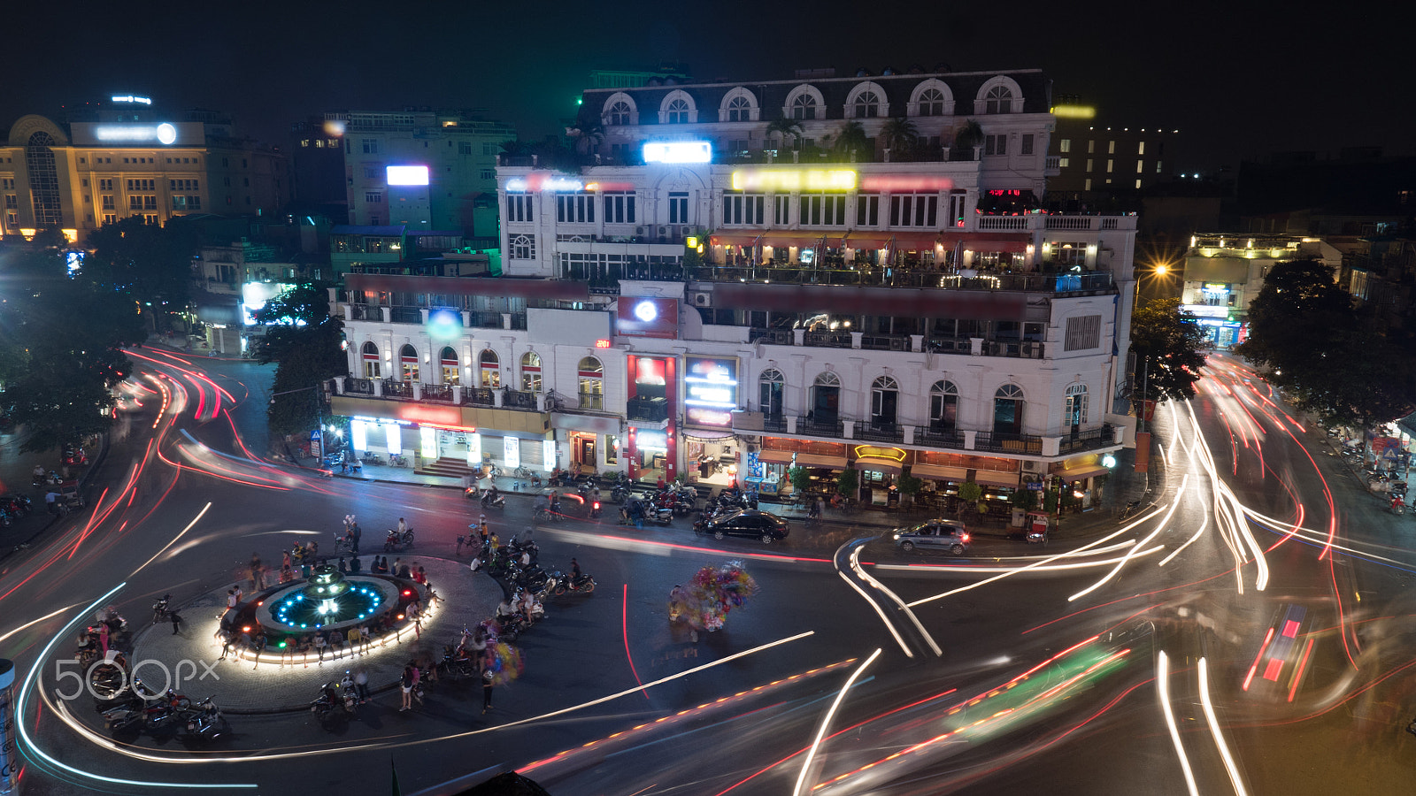 Panasonic Lumix DMC-GH4 + Olympus M.Zuiko Digital ED 7-14mm F2.8 PRO sample photo. Night motion shot of city traffic in night hanoi, vietnam photography