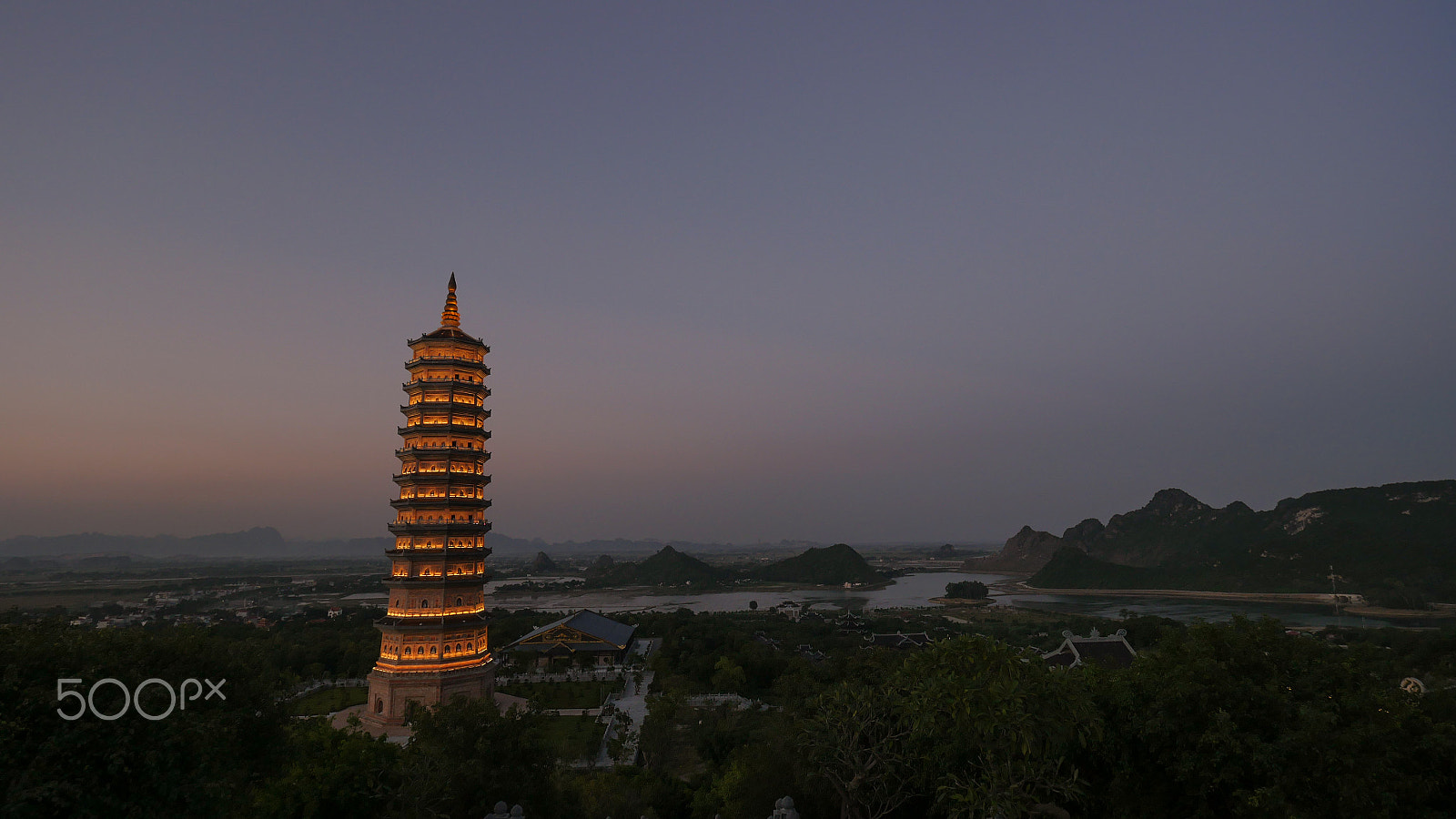 Panasonic Lumix DMC-GH4 + Olympus M.Zuiko Digital ED 7-14mm F2.8 PRO sample photo. Bai dinh temple with illuminated tower in the dusk, vietnam photography