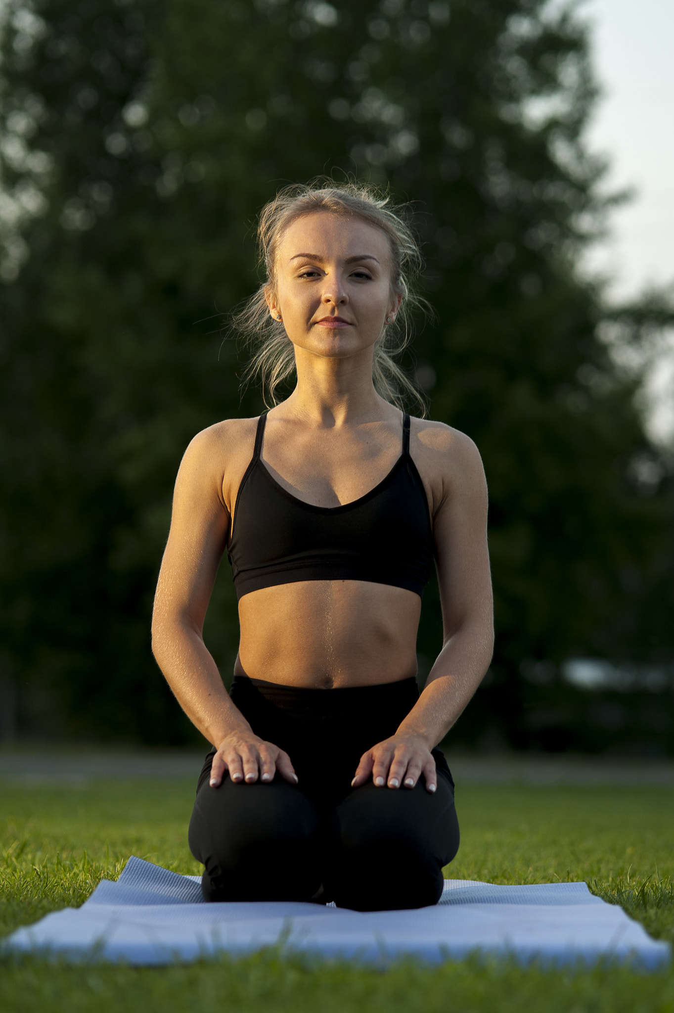 Nikon D700 + AF Micro-Nikkor 105mm f/2.8 sample photo. Serene blonde woman doing yoga on green grass photography