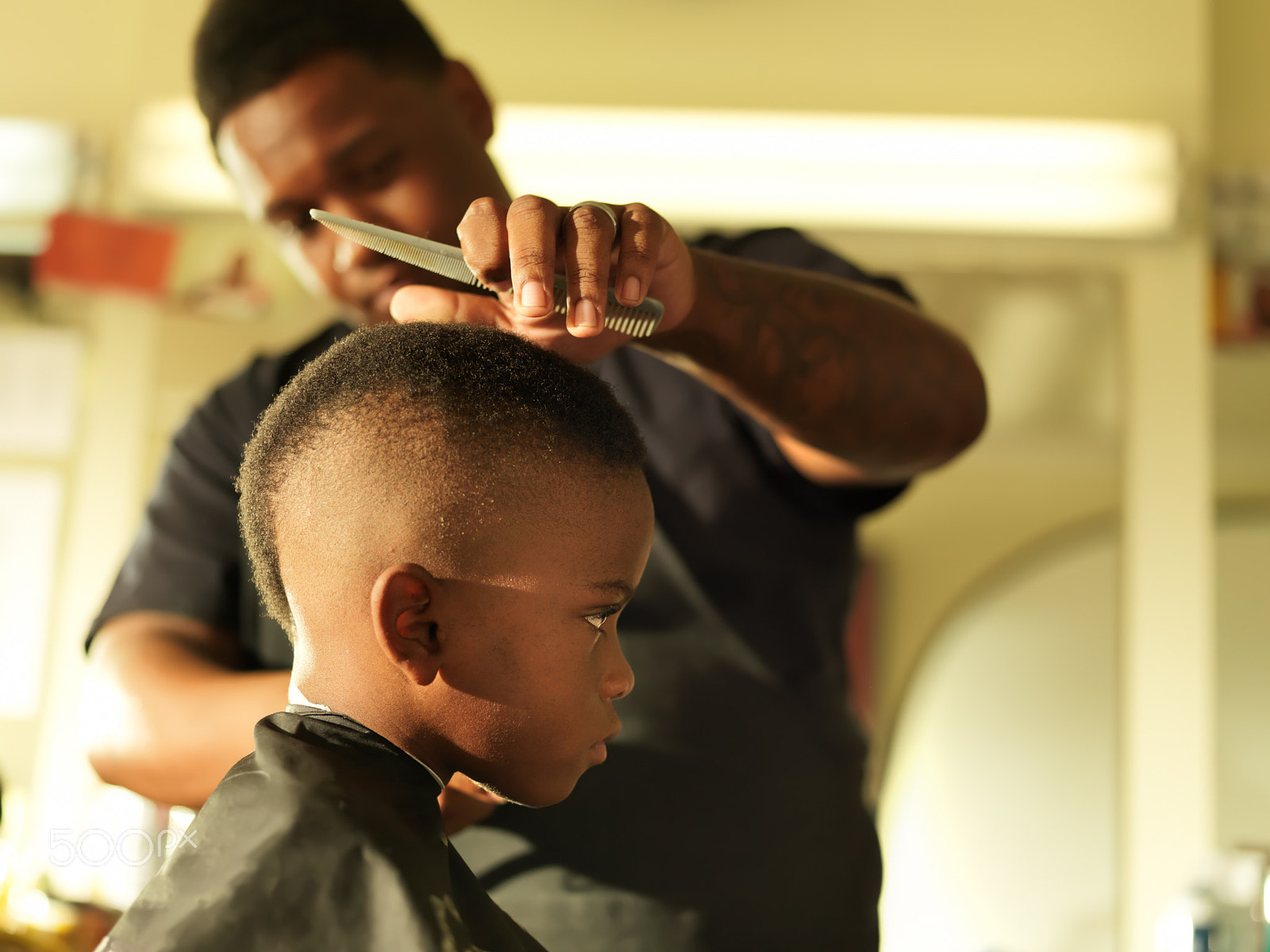 Hasselblad H3DII-39 + HC 80 sample photo. Little boy in barbershop getting head shaved photography