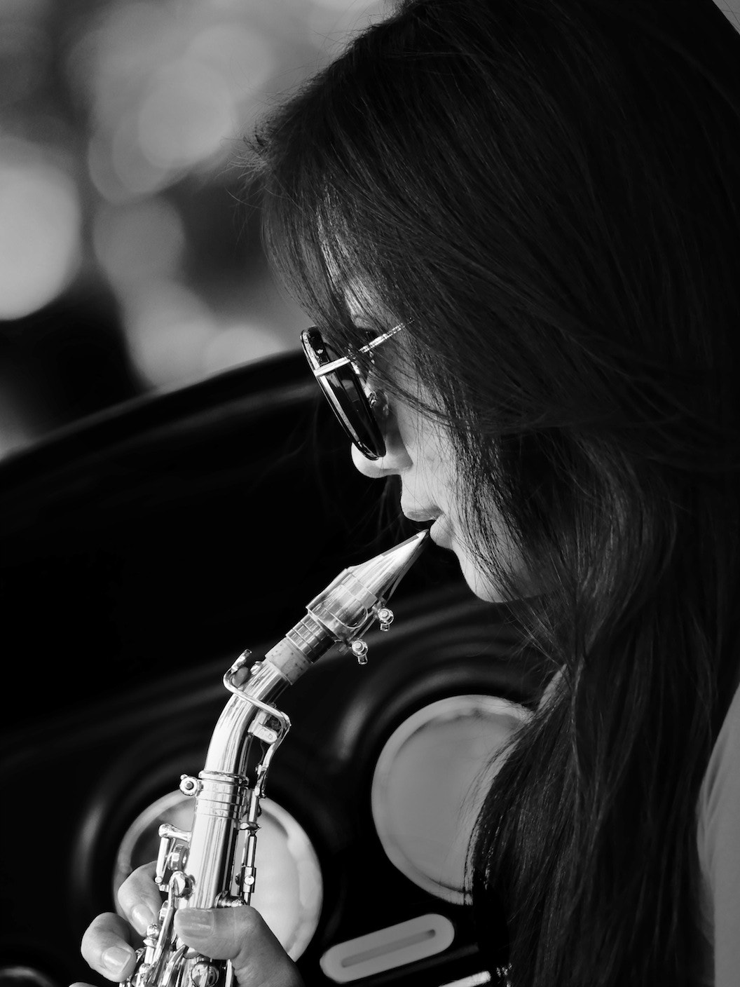Panasonic Lumix DMC-GH4 + LEICA DG 100-400/F4.0-6.3 sample photo. The sax player 2 photography