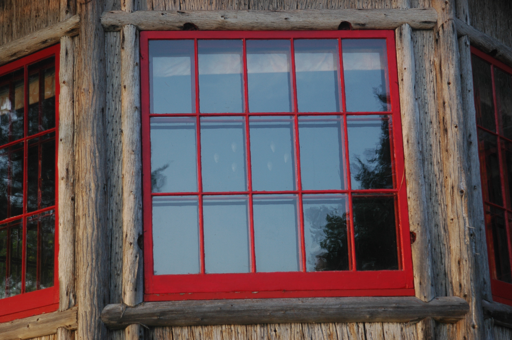 Nikon D70s + AF Zoom-Nikkor 24-120mm f/3.5-5.6D IF sample photo. Red window to an old house photography