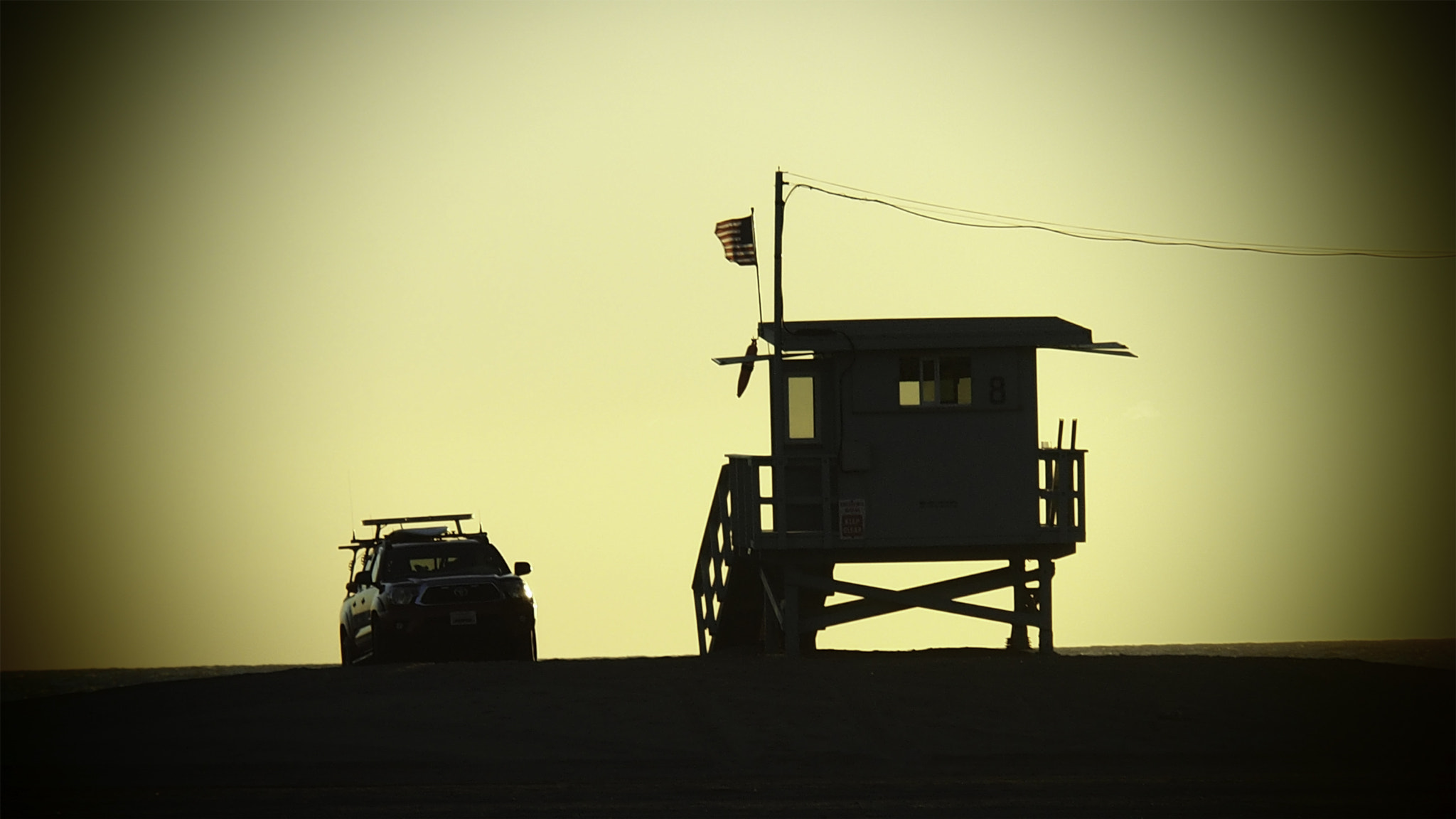 OLYMPUS M.14-150mm F4.0-5.6 II sample photo. Sunset lifeguard truck & hut photography