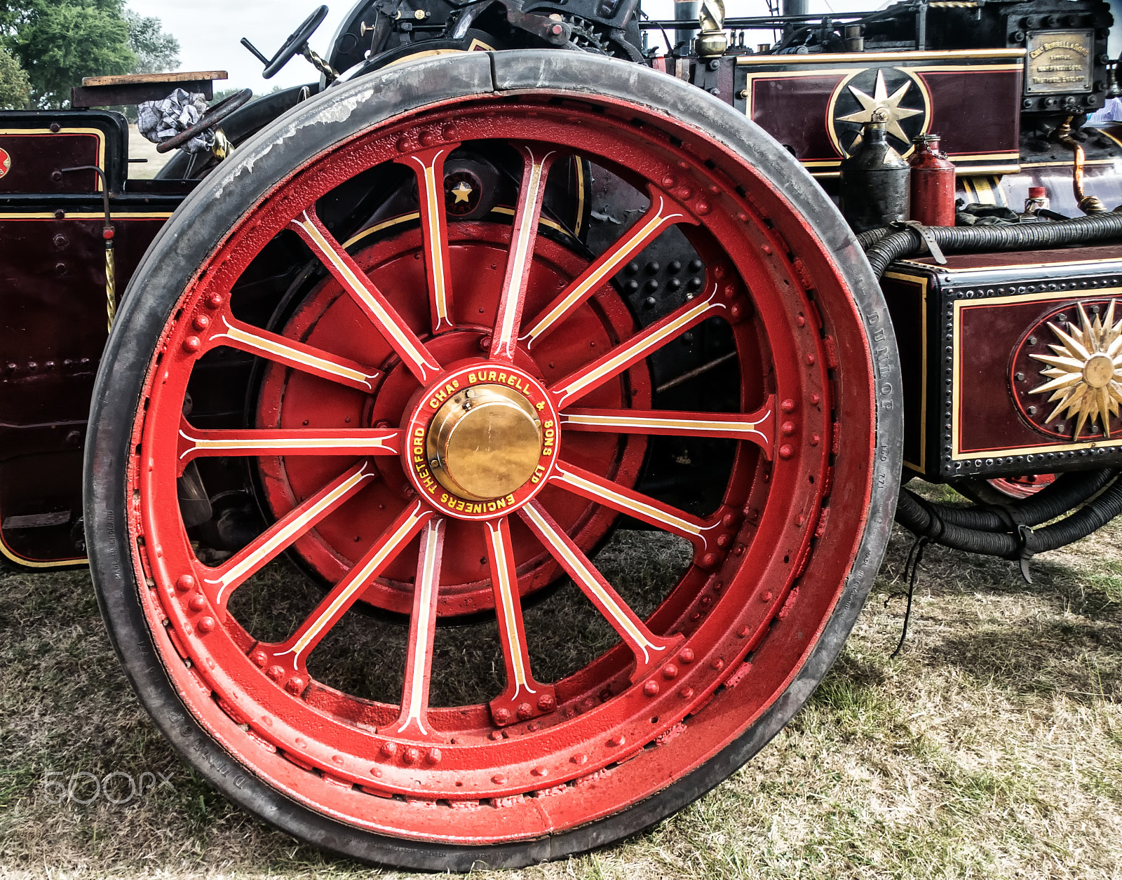 Sony DT 18-250mm F3.5-6.3 sample photo. Steam tractor wheel. photography