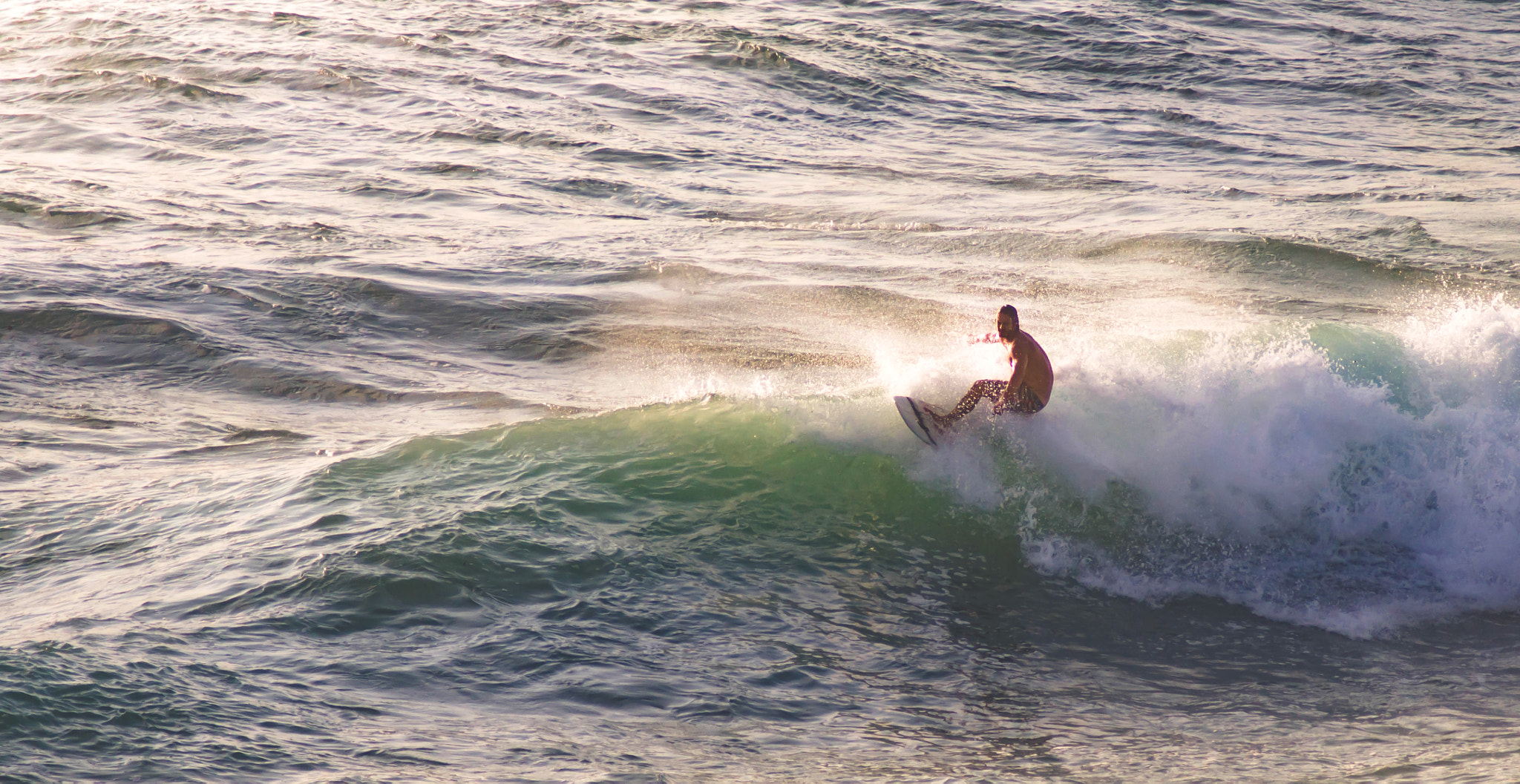 Sony 75-300mm F4.5-5.6 sample photo. Riding the waves photography