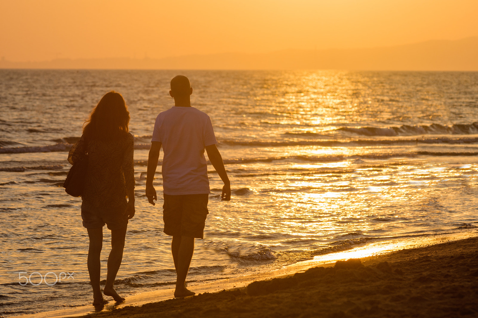 Nikon AF-Nikkor 80-200mm F2.8D ED sample photo. Walking in the sunset photography
