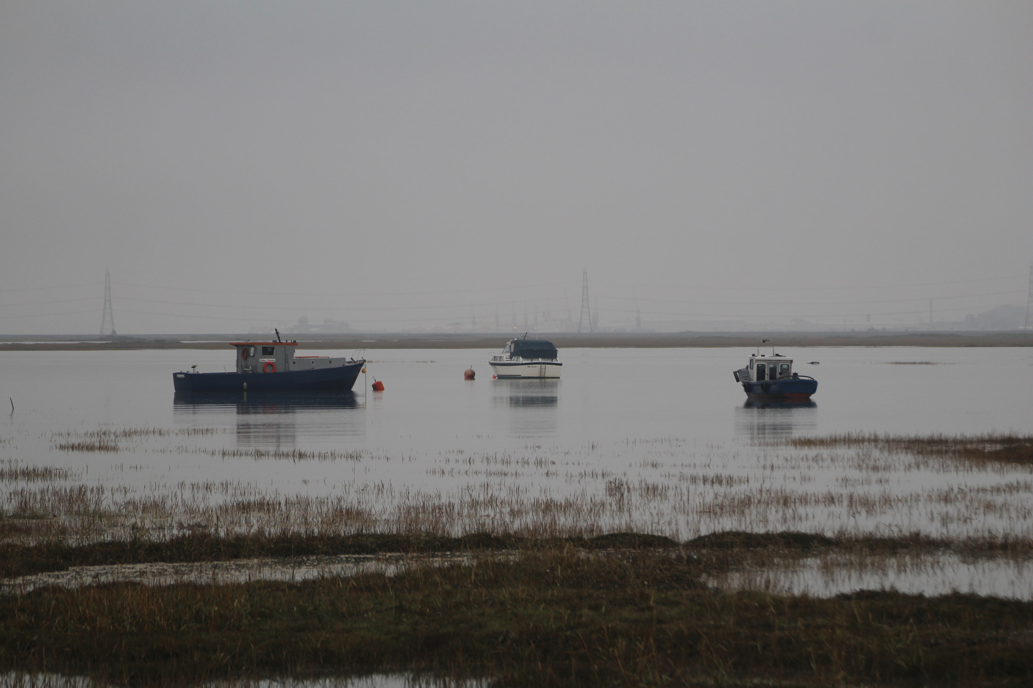 Canon EOS 100D (EOS Rebel SL1 / EOS Kiss X7) + Tamron SP 70-300mm F4-5.6 Di VC USD sample photo. Some boats on the river on an eerie day. photography