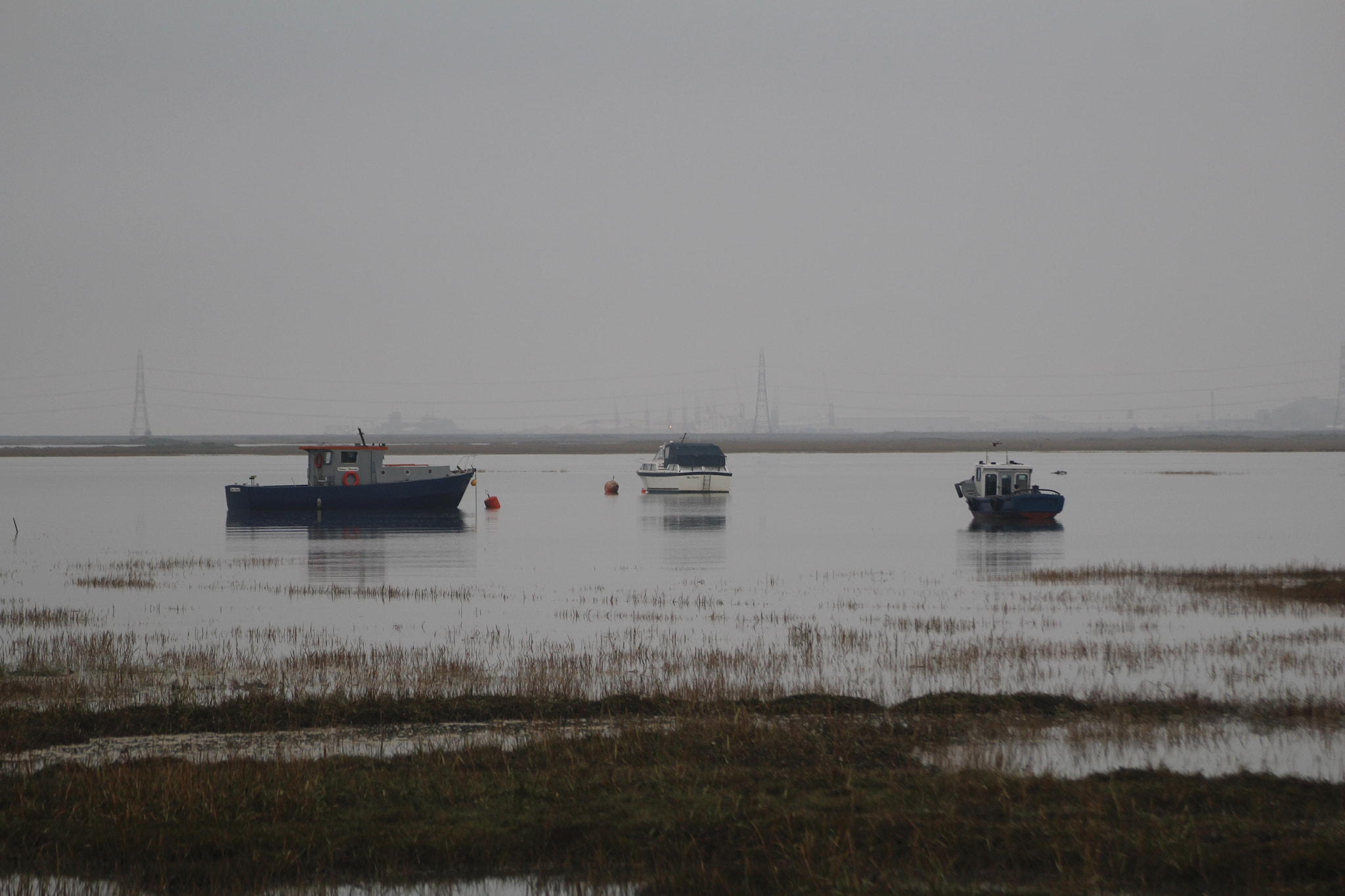Canon EOS 100D (EOS Rebel SL1 / EOS Kiss X7) sample photo. Some boats on the river on an eerie day. photography