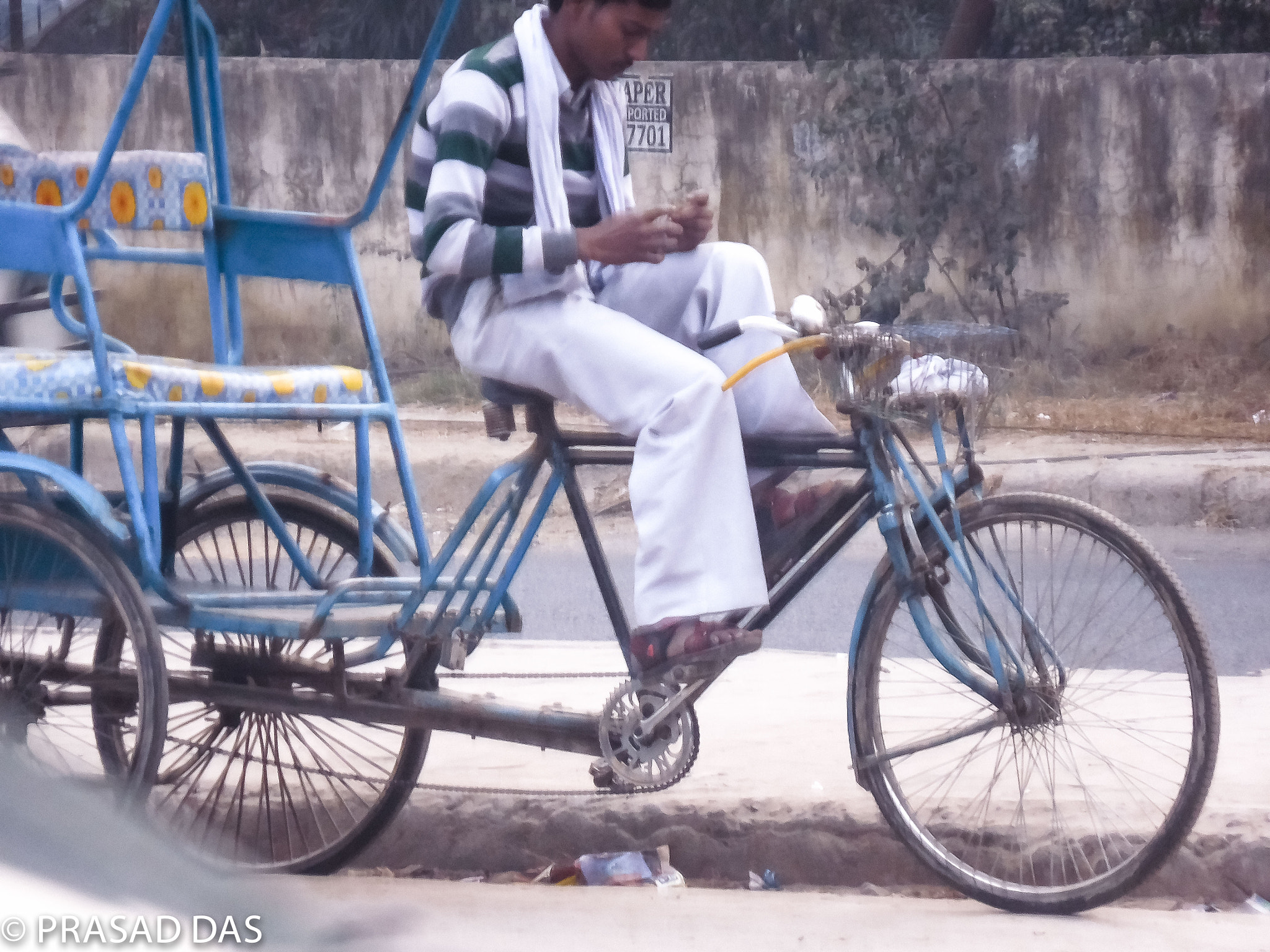 Nikon Coolpix S6900 sample photo. On the street of new delhi rickshawman waiting for customer (of ) photography