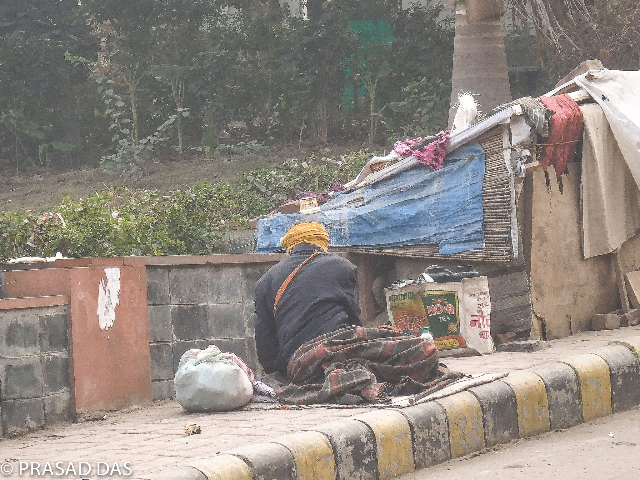 Nikon Coolpix S6900 sample photo. On the street of new delhi homeless and foggy (of ) photography