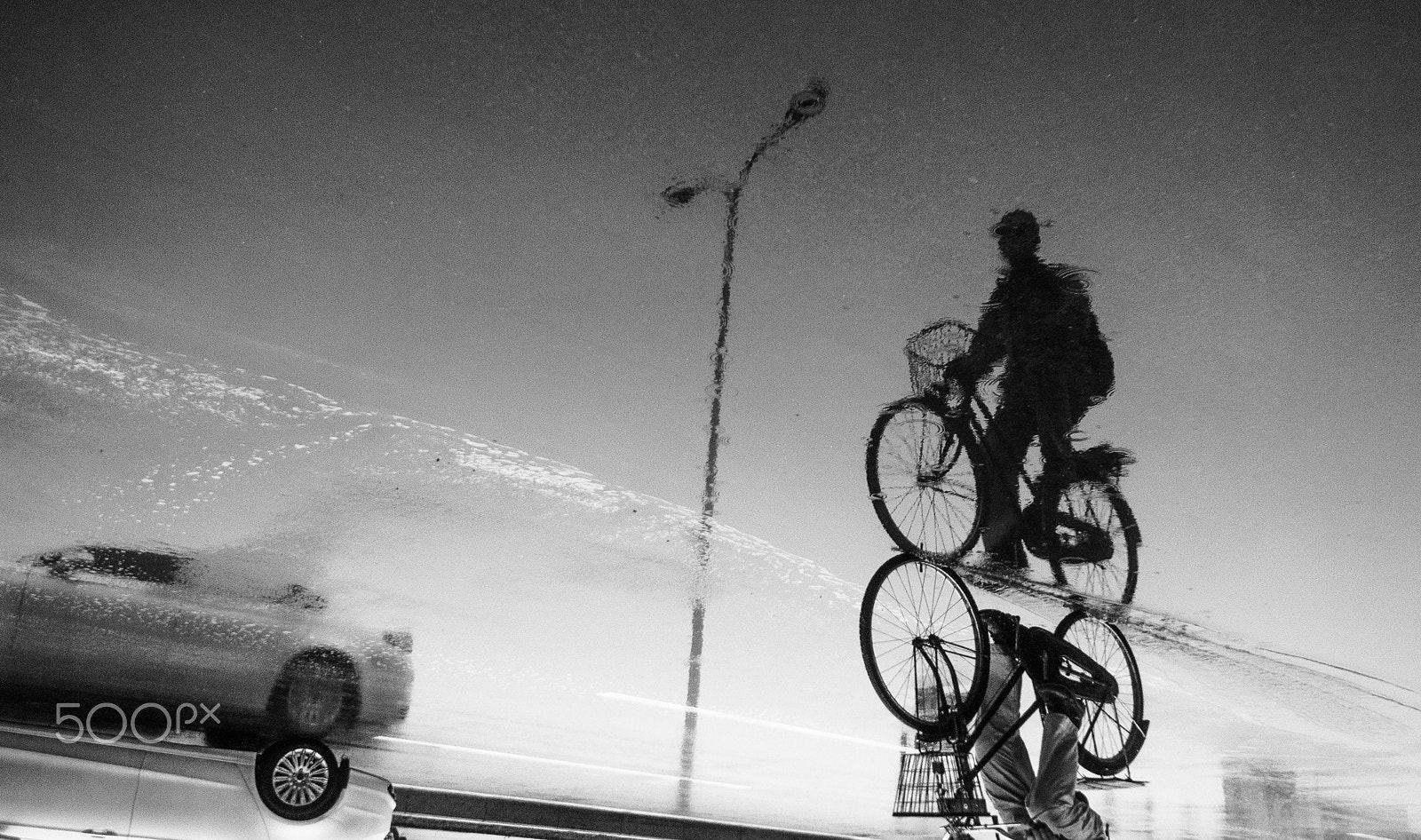 Sony Alpha NEX-5 + Sony E 16mm F2.8 sample photo. The man on the bicycle photography