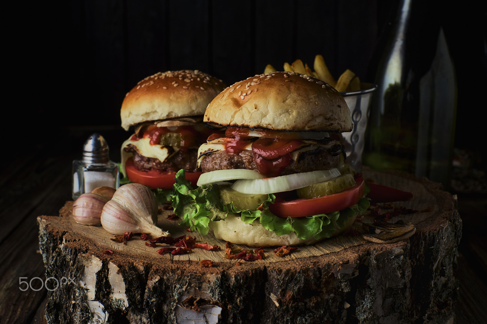 Minolta AF 50mm F1.4 [New] sample photo. Two beef burgers on a dark background. photography