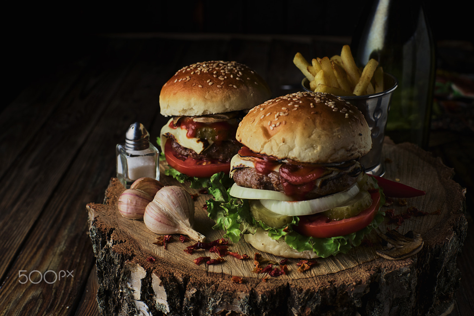 Sony a99 II + Minolta AF 50mm F1.4 [New] sample photo. Two beef burgers on a dark background. photography