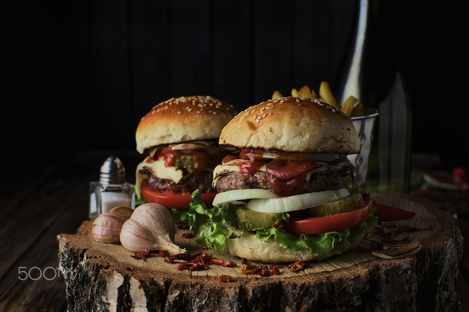 Sony a99 II + Minolta AF 50mm F1.4 [New] sample photo. Two beef burgers on a dark background. photography