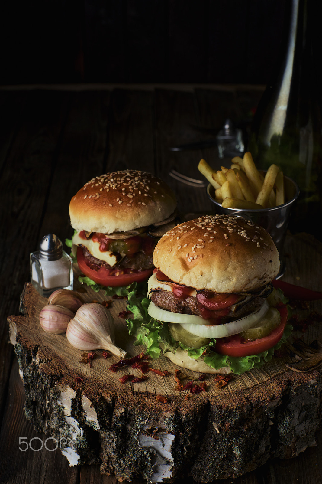 Sony a99 II + Minolta AF 50mm F1.4 [New] sample photo. Two beef burgers on a dark background. photography