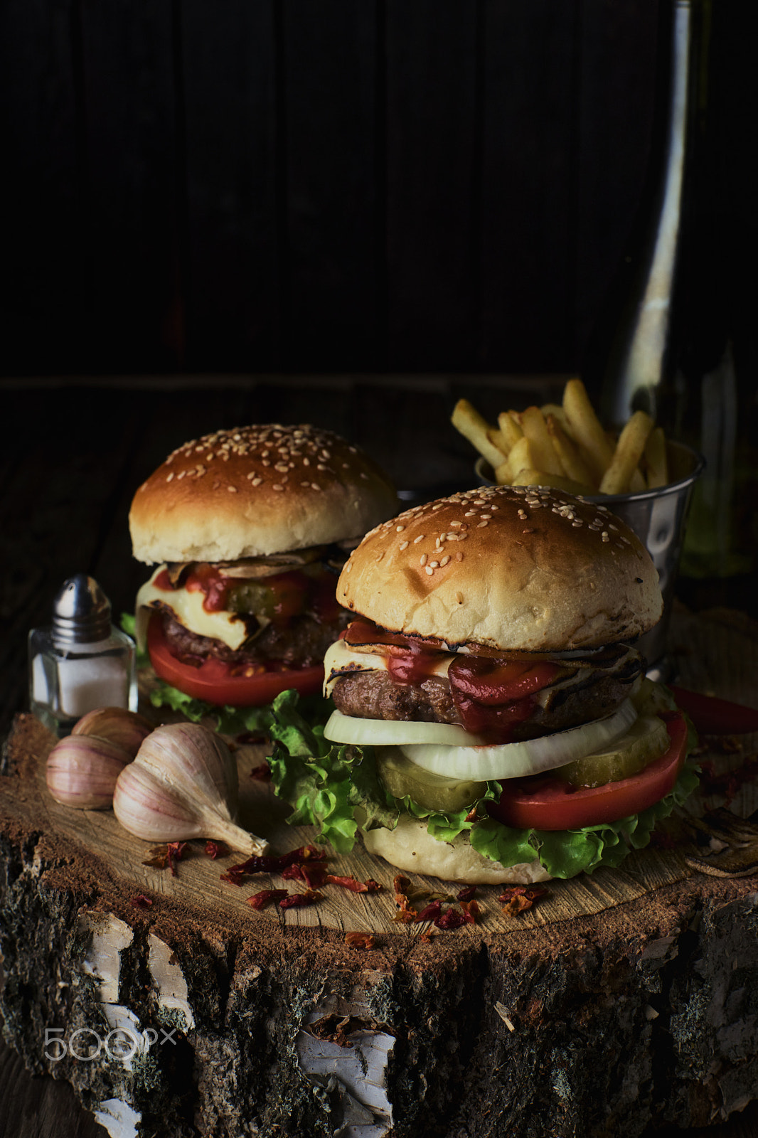 Sony a99 II + Minolta AF 50mm F1.4 [New] sample photo. Two beef burgers on a dark background. photography